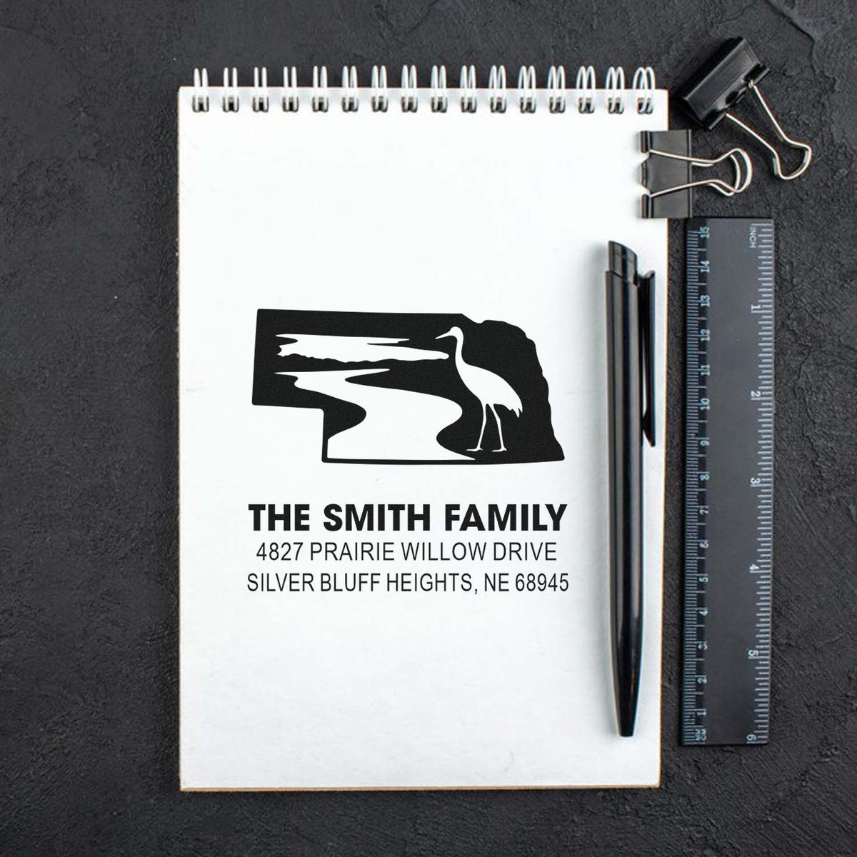 Custom return address rubber stamp with Nebraska state design and bird for The Smith Family, Silver Bluff Heights, NE 68945.