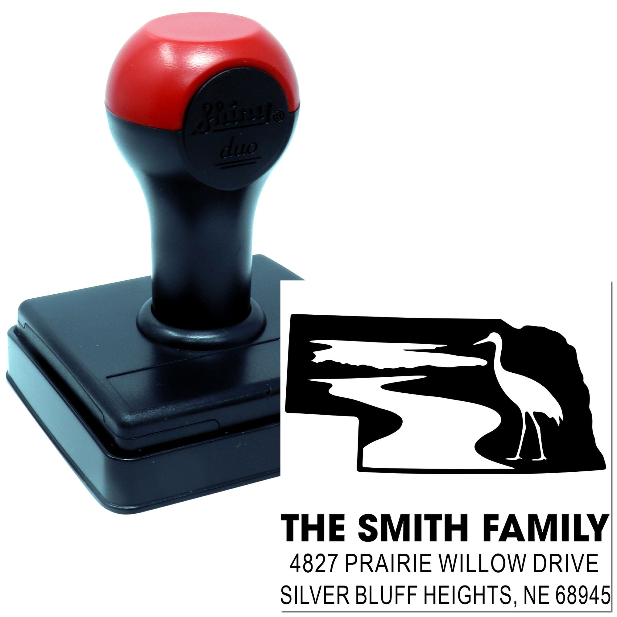 Custom self-inking rubber address stamp with family name and address for personalized mailing.