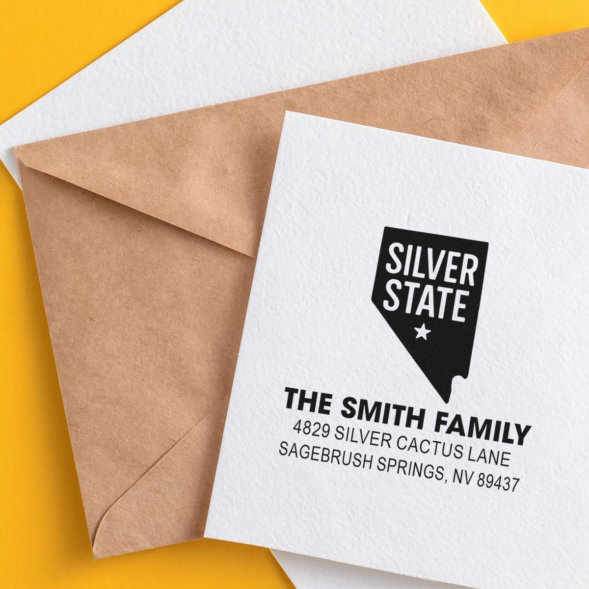 Custom rubber stamp return address on a white envelope, featuring a Silver State Nevada design for family mailings.