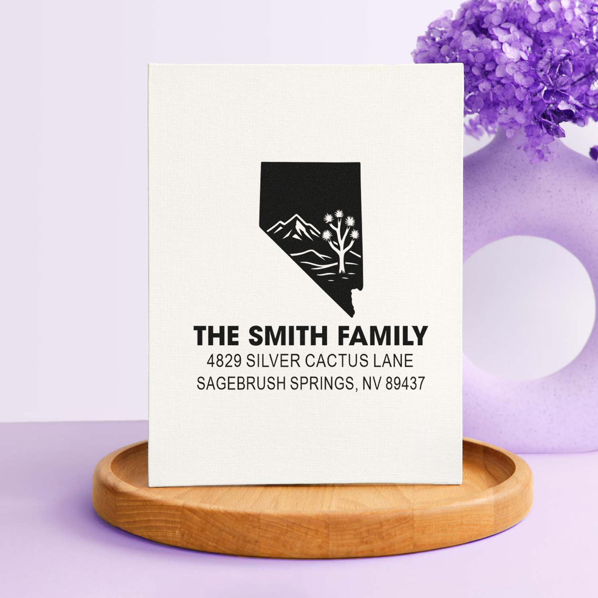 Custom family return address rubber stamp with Nevada mountain and tree design for personalized mail and stationery.