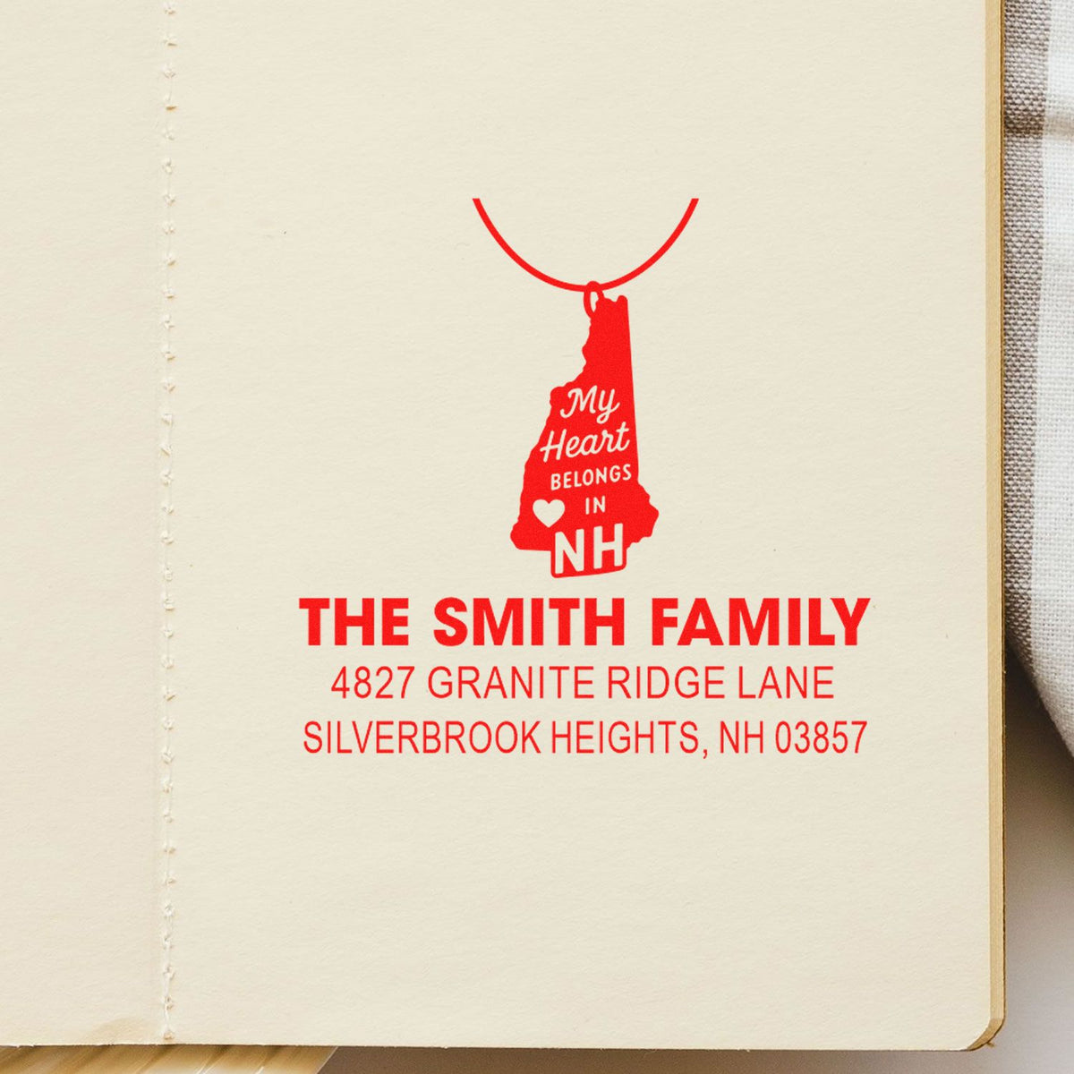 Custom New Hampshire return address rubber stamp with family name, street address, and My Heart Belongs in NH design.