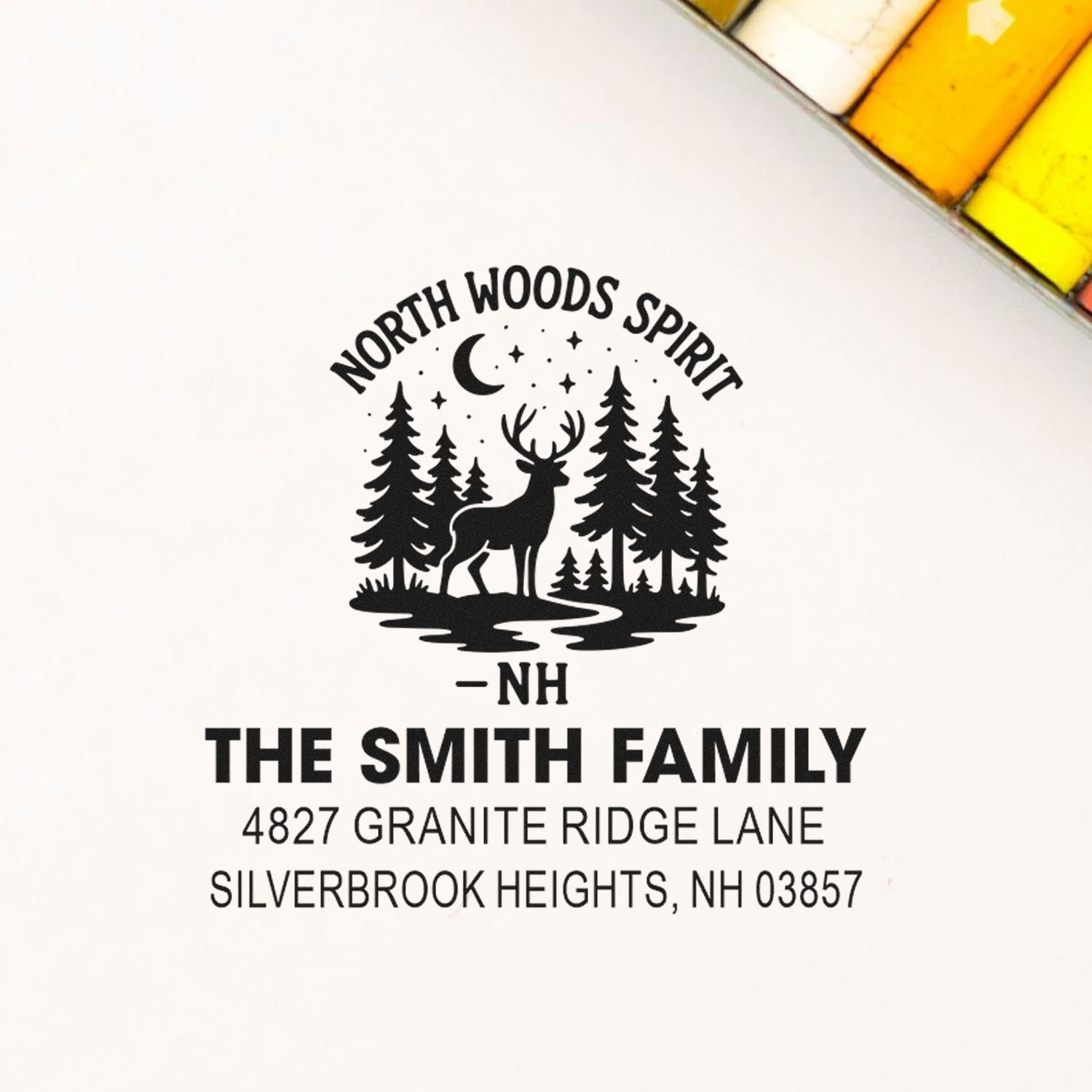 Custom return address rubber stamp for The Smith Family, with deer, pine trees and Silverbrook Heights, NH woodland design.