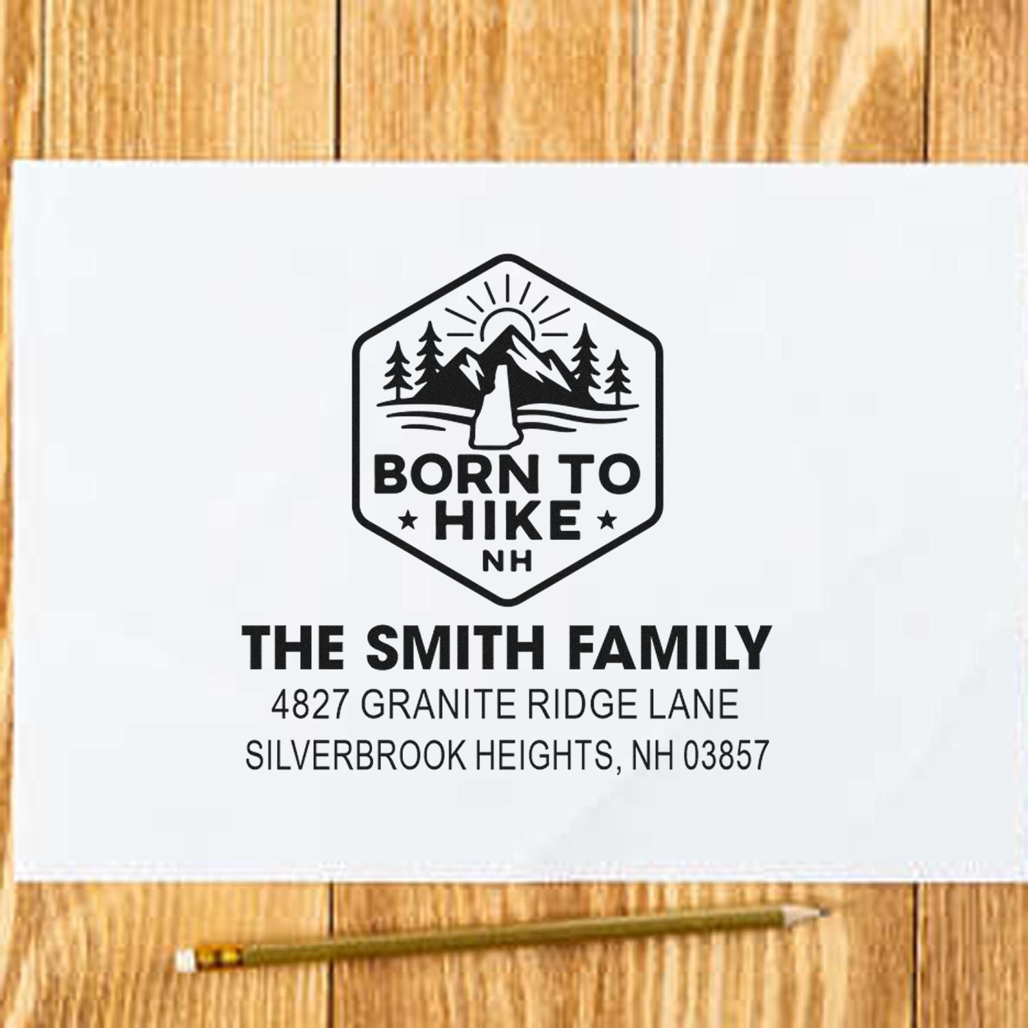 Custom return address rubber stamp with Born to Hike logo, personalized family name and New Hampshire address
