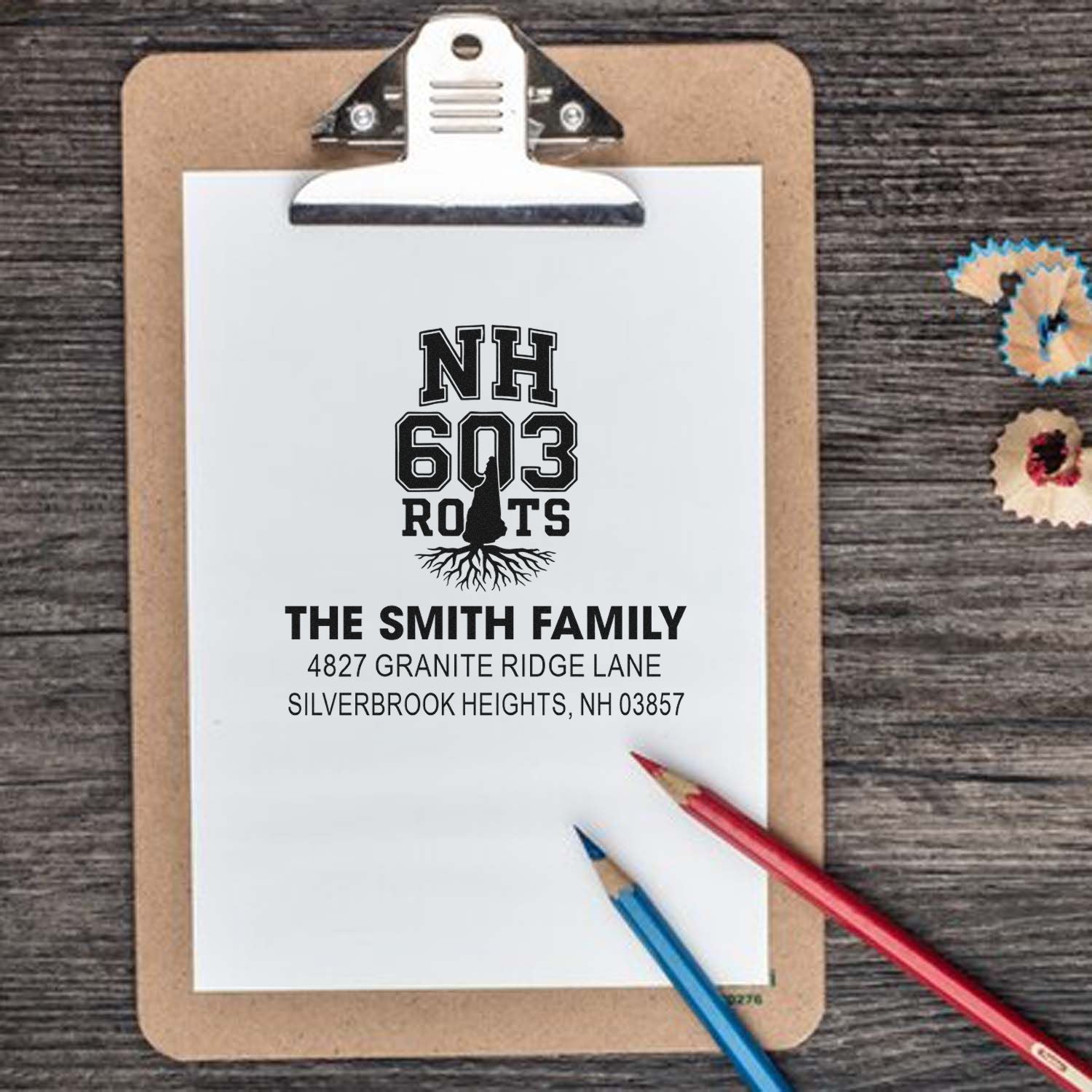 Personalized rubber stamp proof for The Smith Family, featuring NH 603 Roots and custom address.