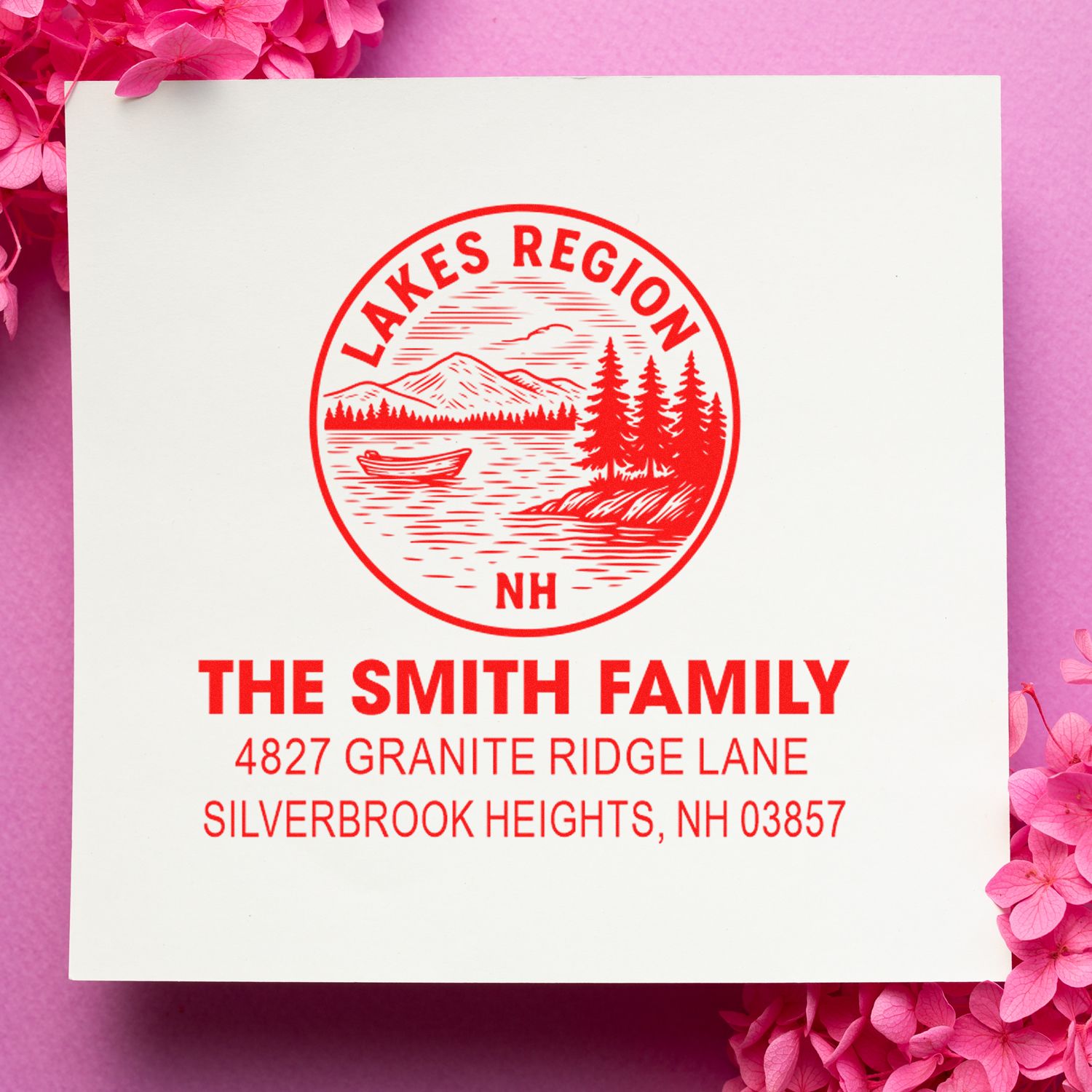 Custom return address rubber stamp for The Smith Family, Lakes Region NH, with mountain lake logo and address design.