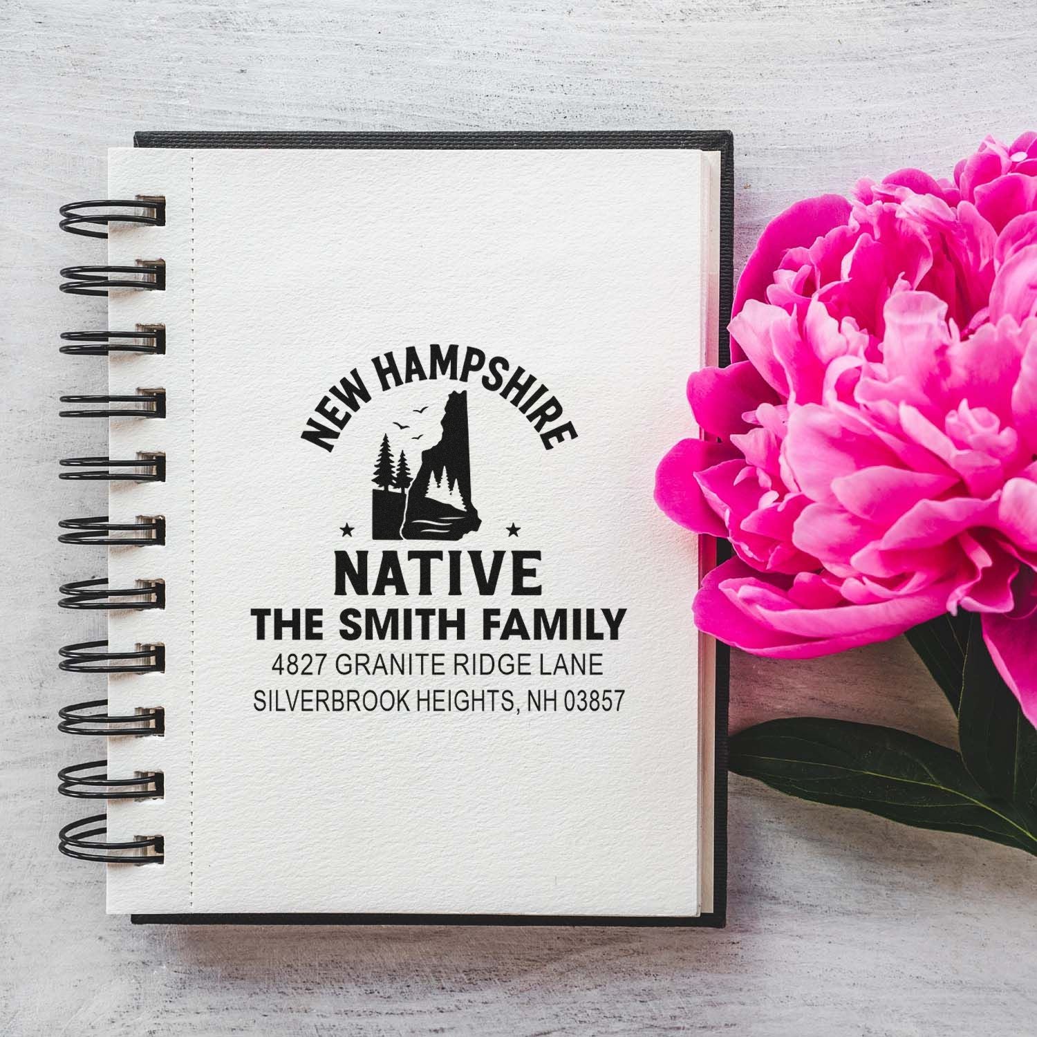 Custom New Hampshire native rubber stamp with family name and address for personalized stationery.