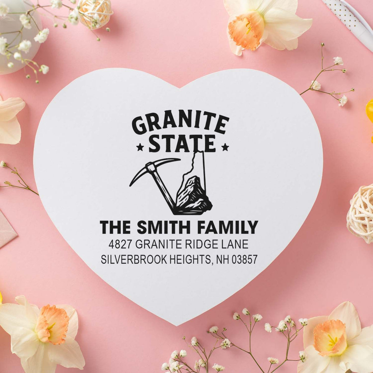 Custom heart-shaped rubber return address stamp for the Smith family with Granite State design and pickaxe icon.