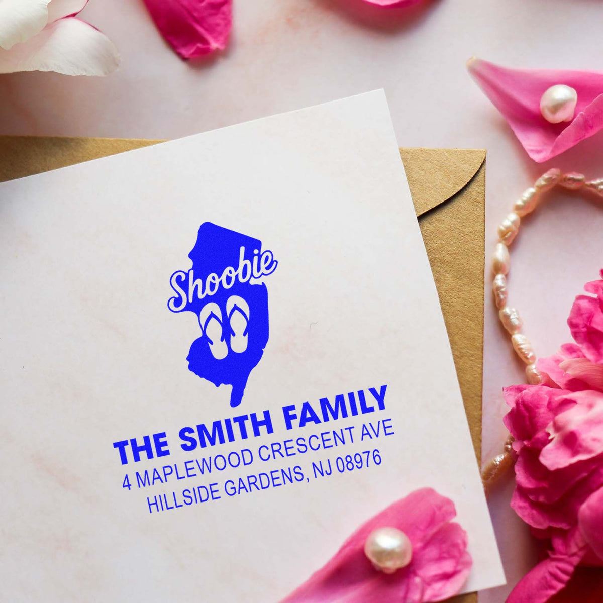 Personalized rubber stamp return address for The Smith Family wedding invitation envelope with blue Shoobie design.