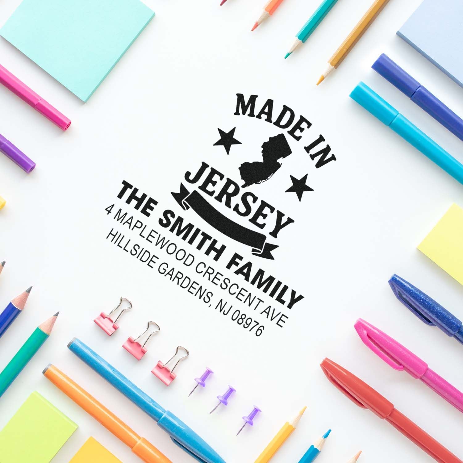 Custom rubber address stamp for The Smith Family, Made in Jersey, with personalized return address imprint on paper.