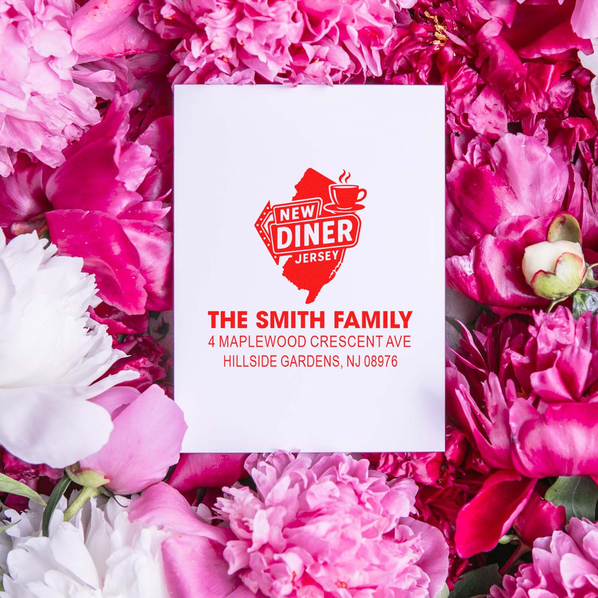 Custom address rubber stamp with New Jersey diner logo for The Smith Family, shown on a floral stationery card.