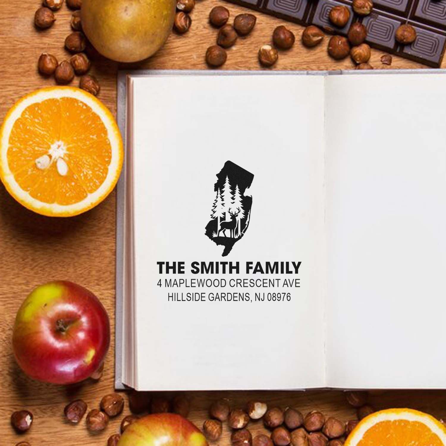 Personalized family address rubber stamp with custom name, address and woodland deer silhouette for stationery and mailing.