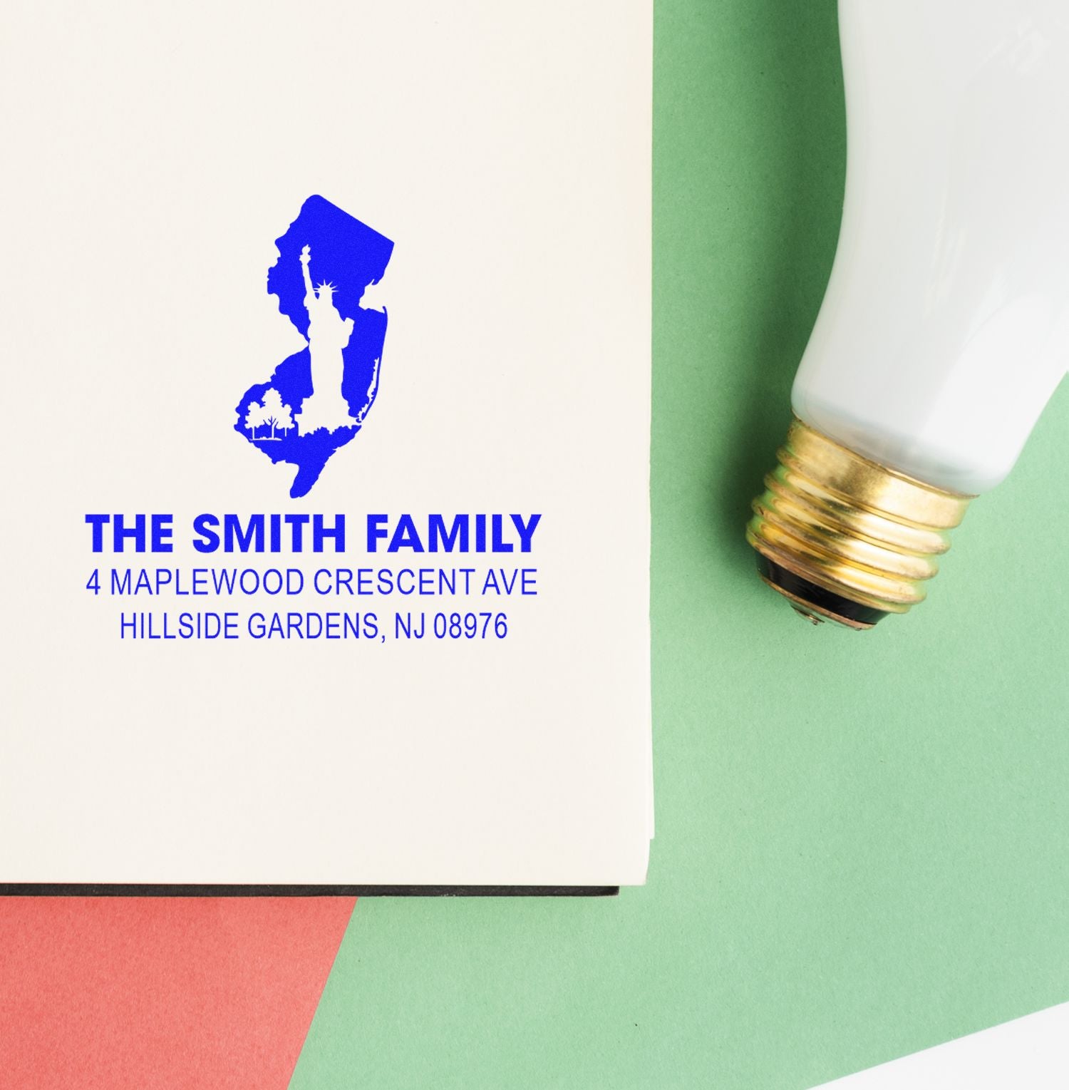 Custom family address rubber stamp impression with New Jersey silhouette, personalized name, and mailing address.