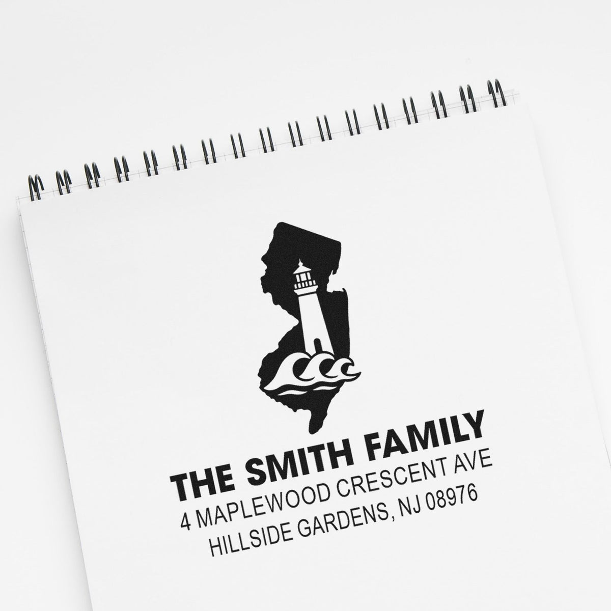 Personalized family address rubber stamp with lighthouse logo and New Jersey return address for mailing envelopes.