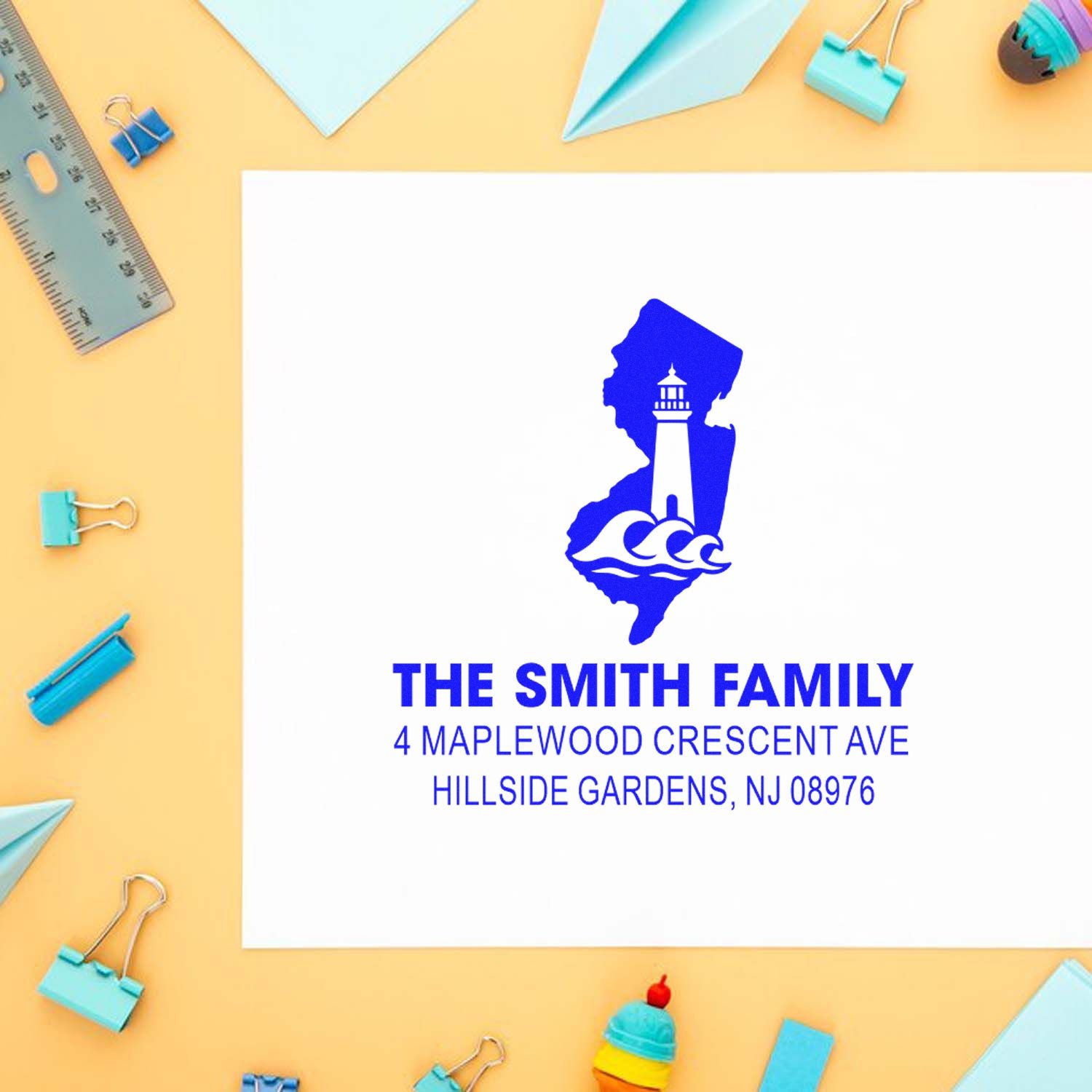 Custom rubber address stamp for The Smith Family with lighthouse logo and Hillside Gardens, NJ return address.
