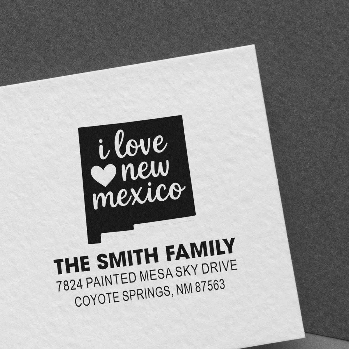 Custom rubber stamp with I love New Mexico design and Smith family address for personalized mailing.