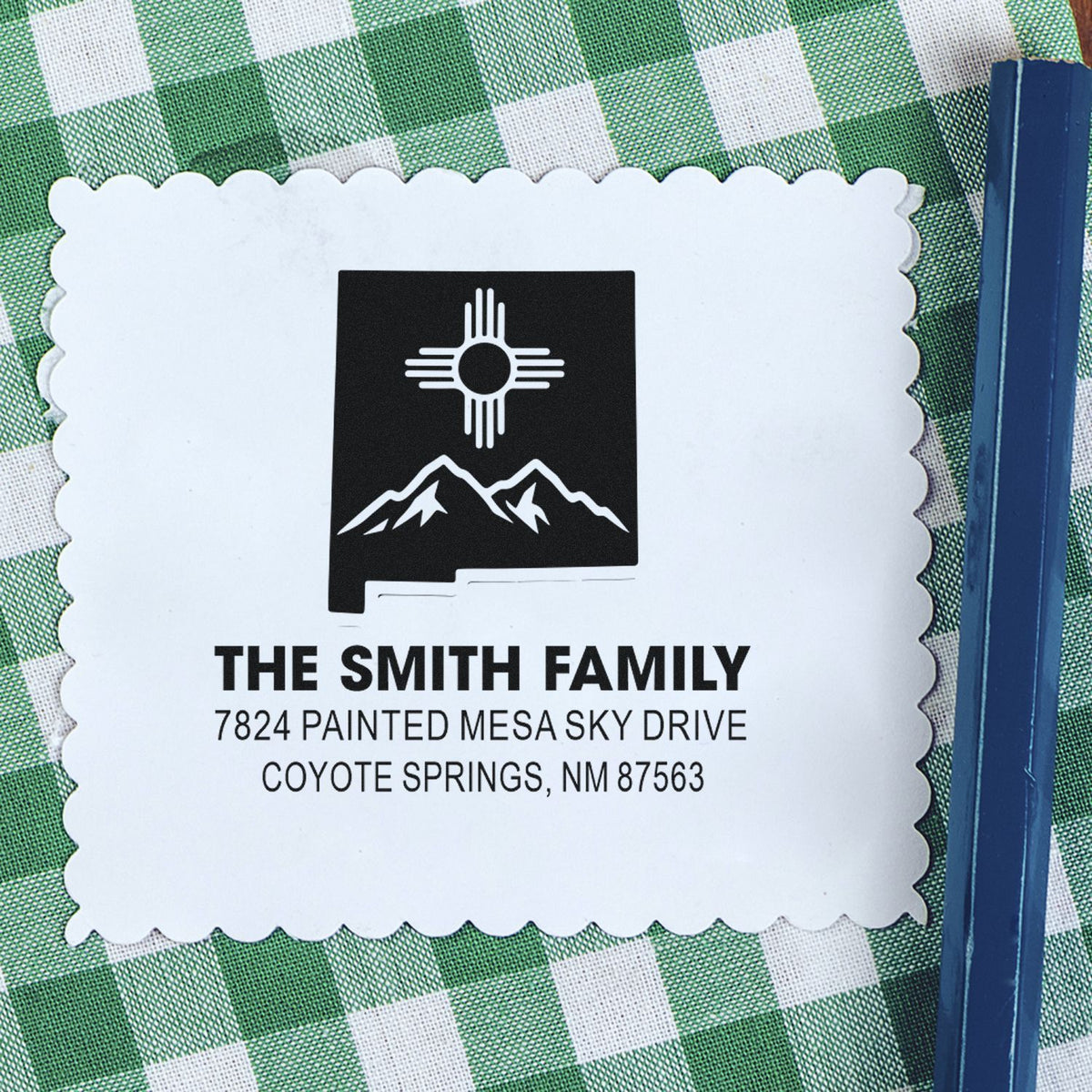 Custom return address rubber stamp for The Smith Family, featuring Zia sun and mountain design, Coyote Springs, NM.