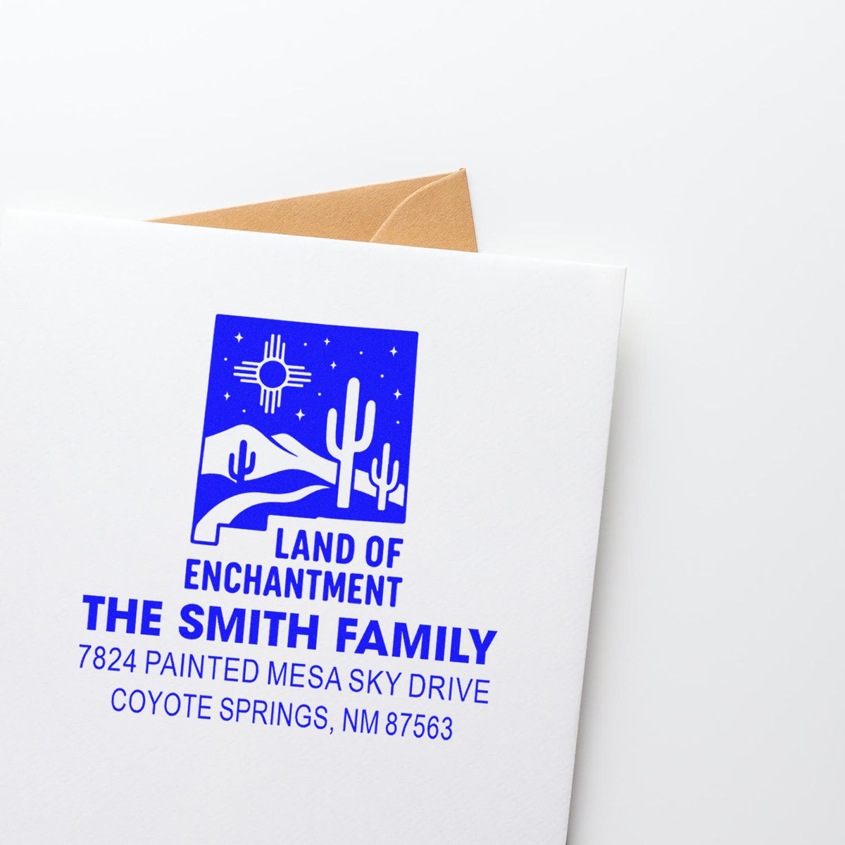 Custom rubber address stamp with desert motif for The Smith Family, featuring return address in Coyote Springs, NM.