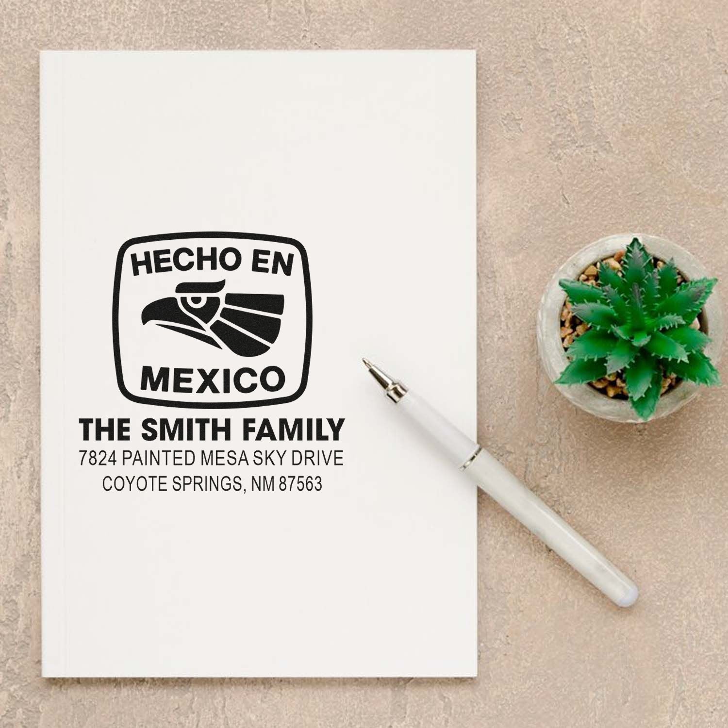 Custom rubber stamp mockup with Hecho en Mexico logo and return address for personalized family stationery.