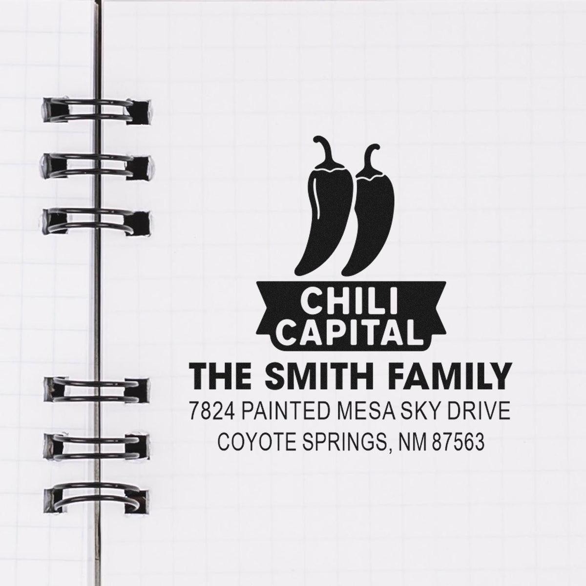 Custom rubber stamp design with chili pepper logo and return address for The Smith Family in Coyote Springs, NM.
