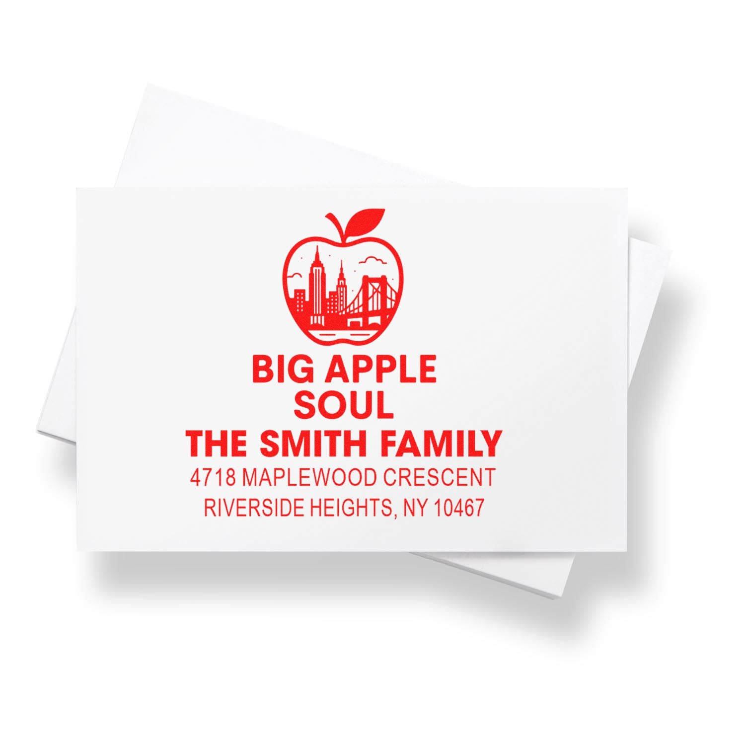Custom rubber stamp with New York City apple skyline logo and personalized family return address for The Smith Family.