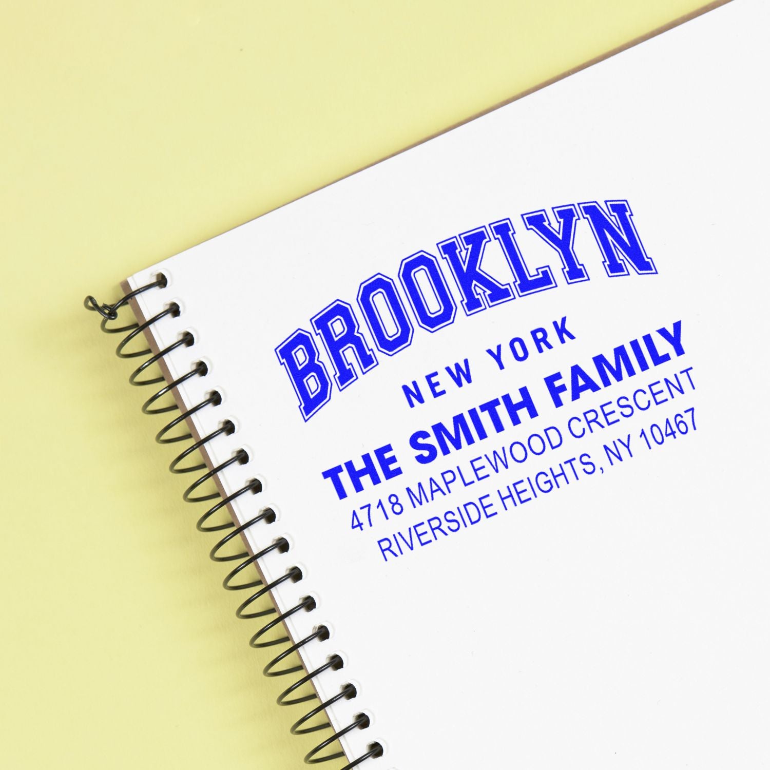 Custom Brooklyn return address rubber stamp for The Smith Family, New York, featuring bold blue lettering.