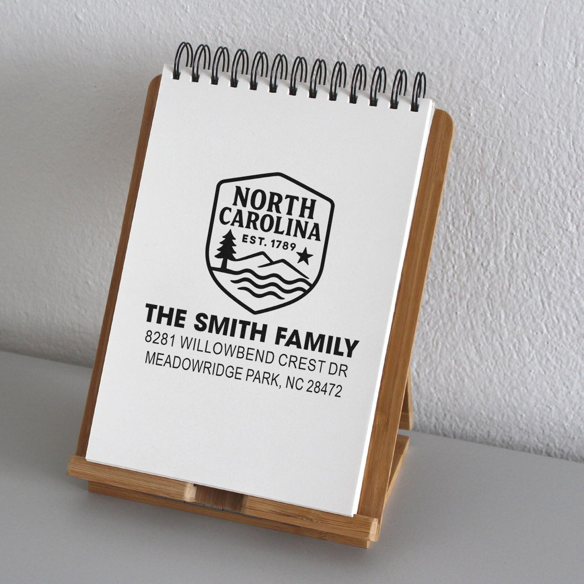 Custom North Carolina family address rubber stamp with crest design for personalized stationery and mailings.