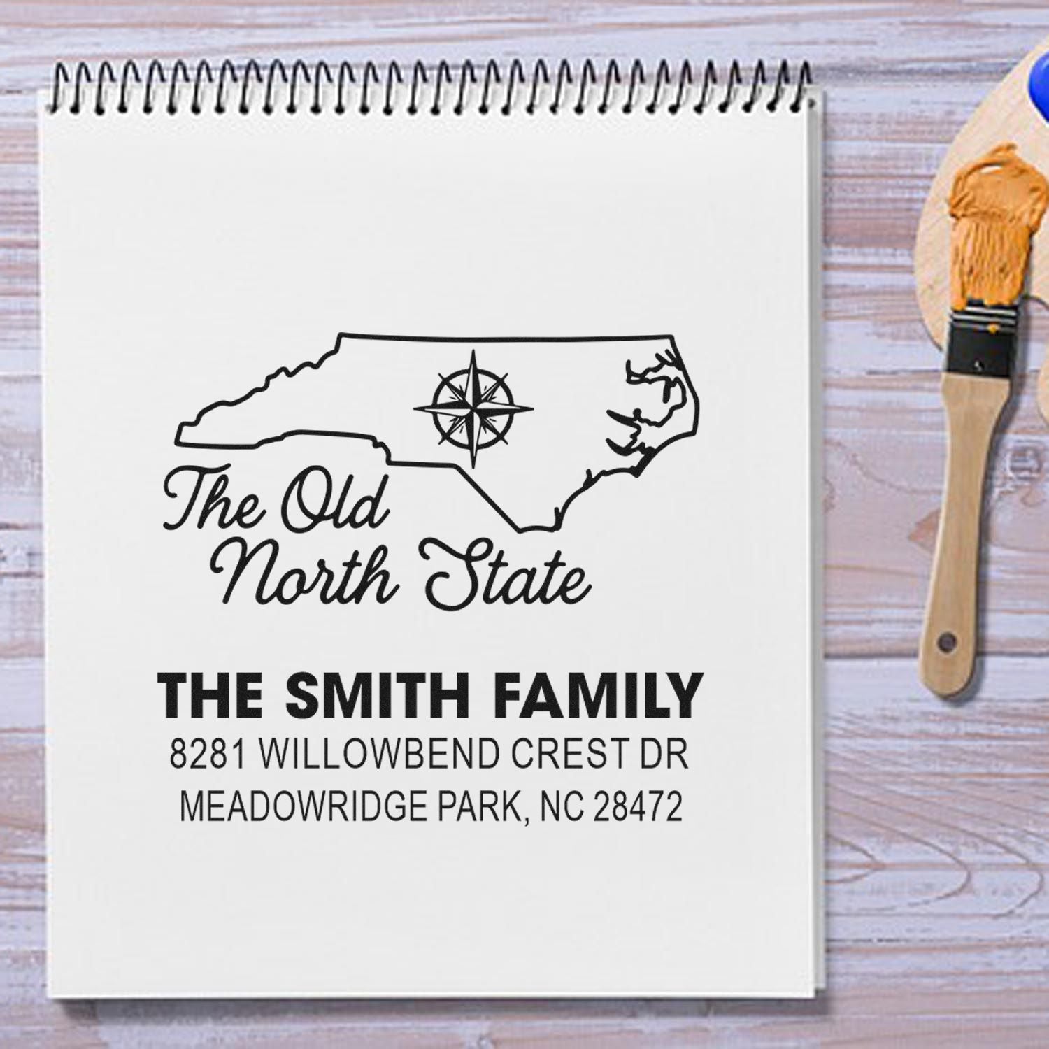 Custom North Carolina return address rubber stamp with family name, address, and Old North State design.