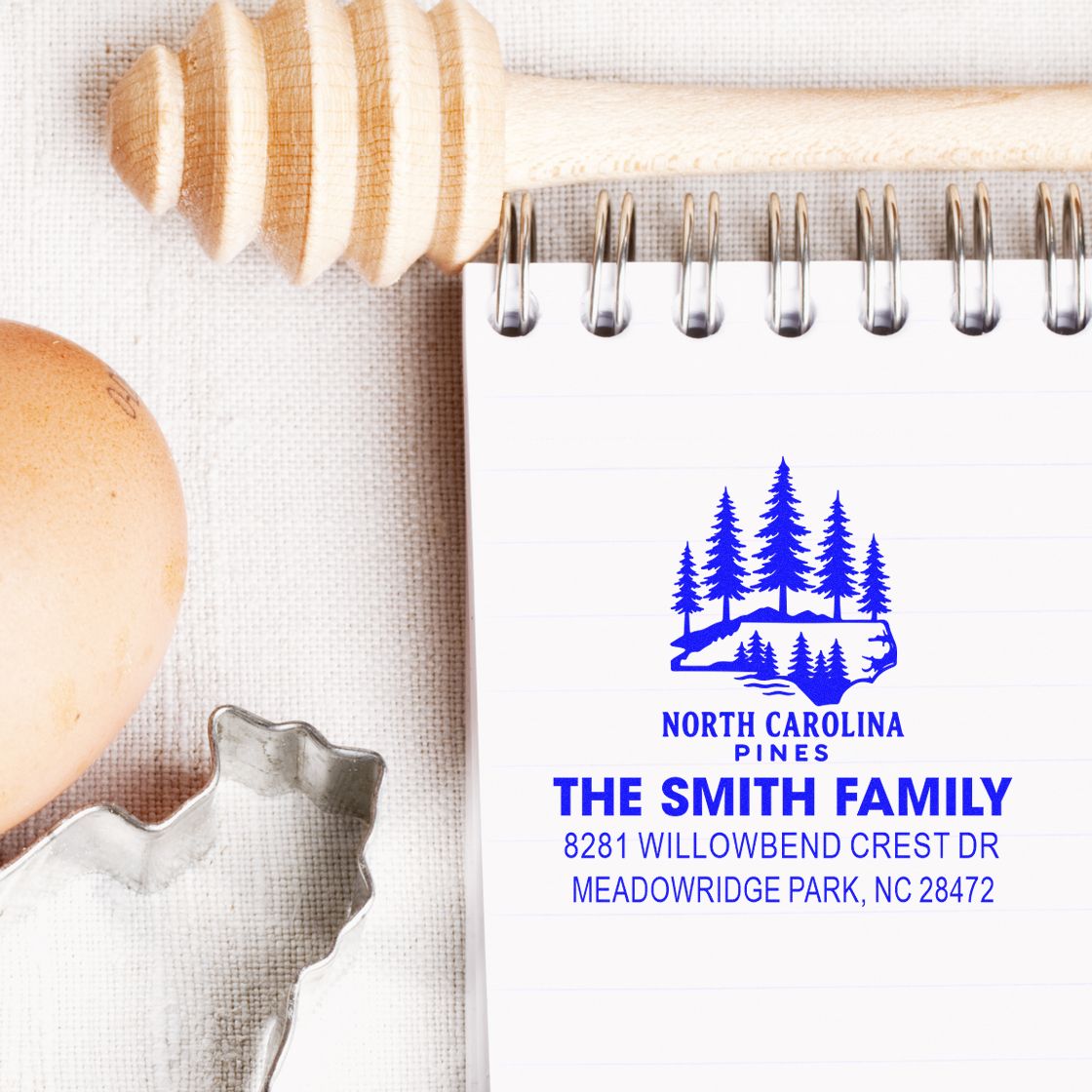 Custom North Carolina Pines return address rubber stamp for The Smith Family, featuring a personalized mailing address on a notebook.