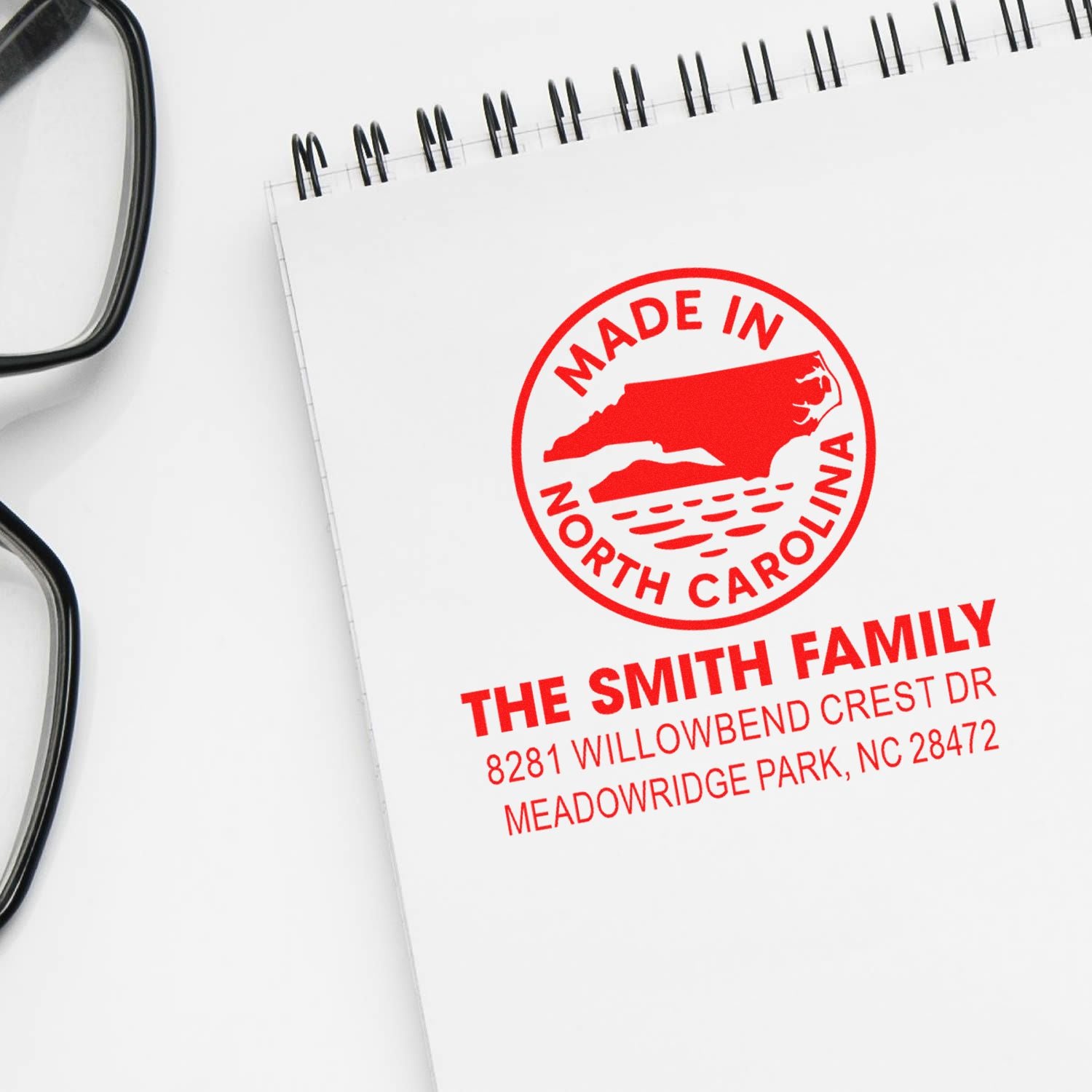Custom red rubber stamp impression with Made in North Carolina logo and The Smith Family return address.