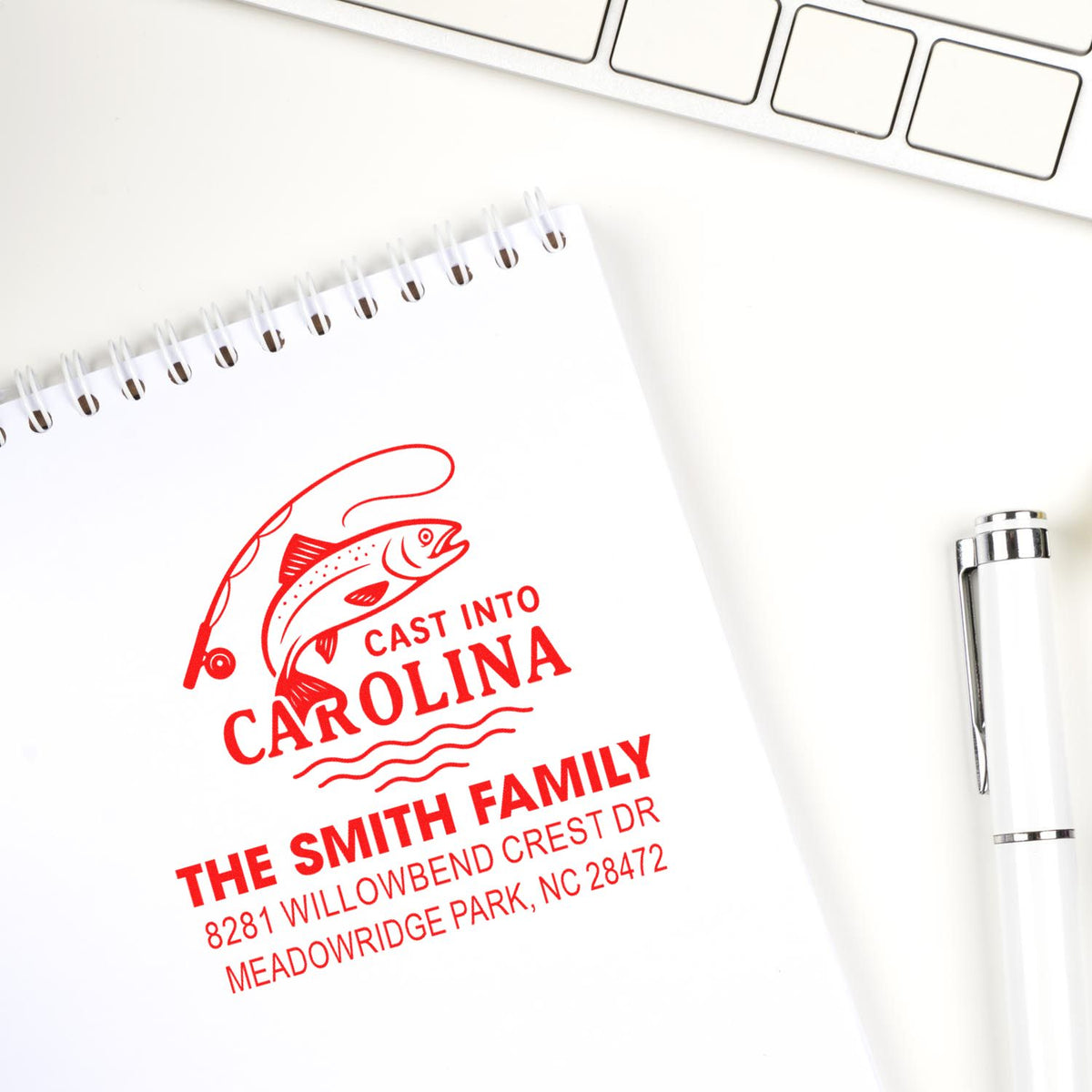Custom fishing-themed rubber stamp with family name and address, ideal for personalized branding and mail labeling.