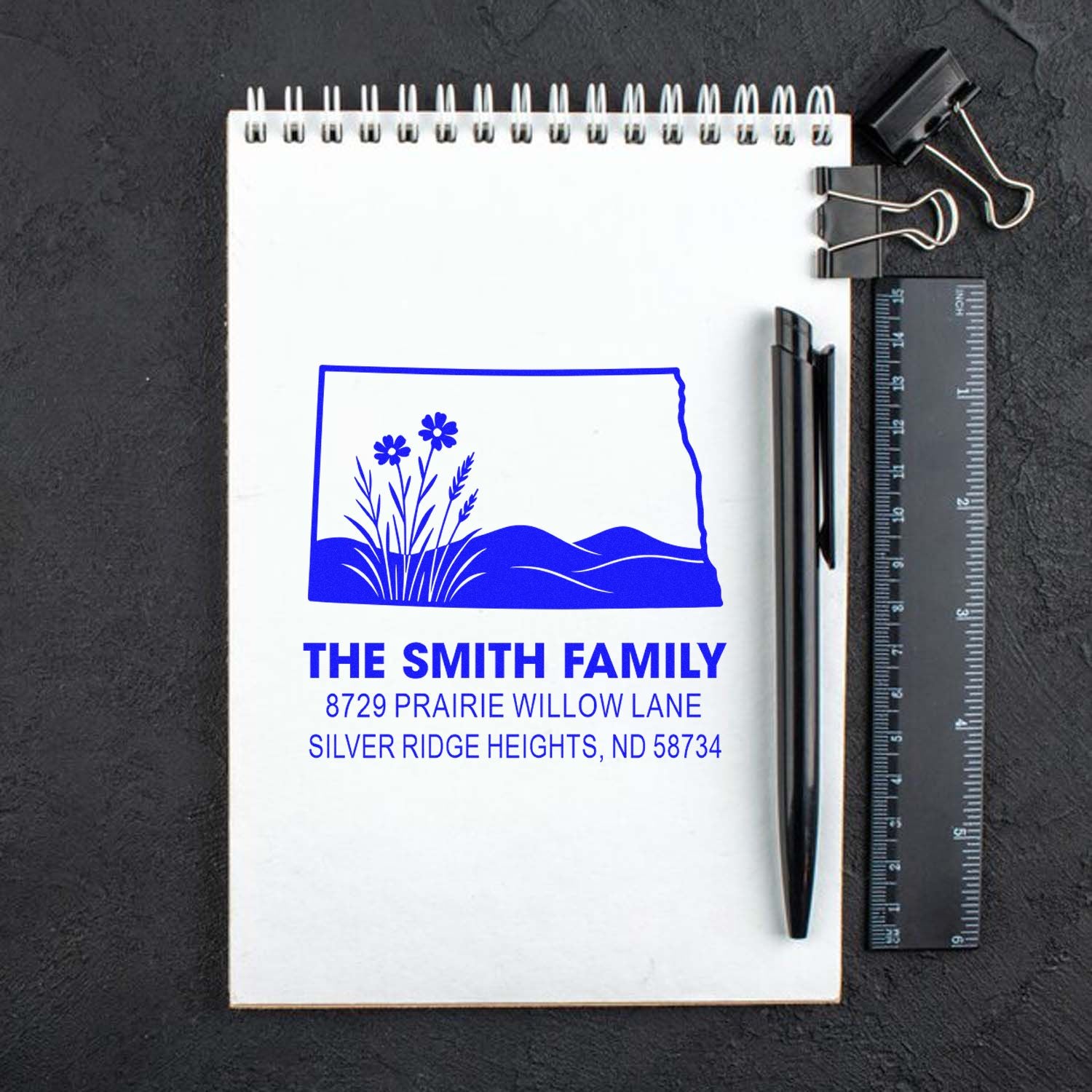 Custom rubber address stamp with prairie wildflower design for The Smith Family, personalized return address stamp in blue ink.