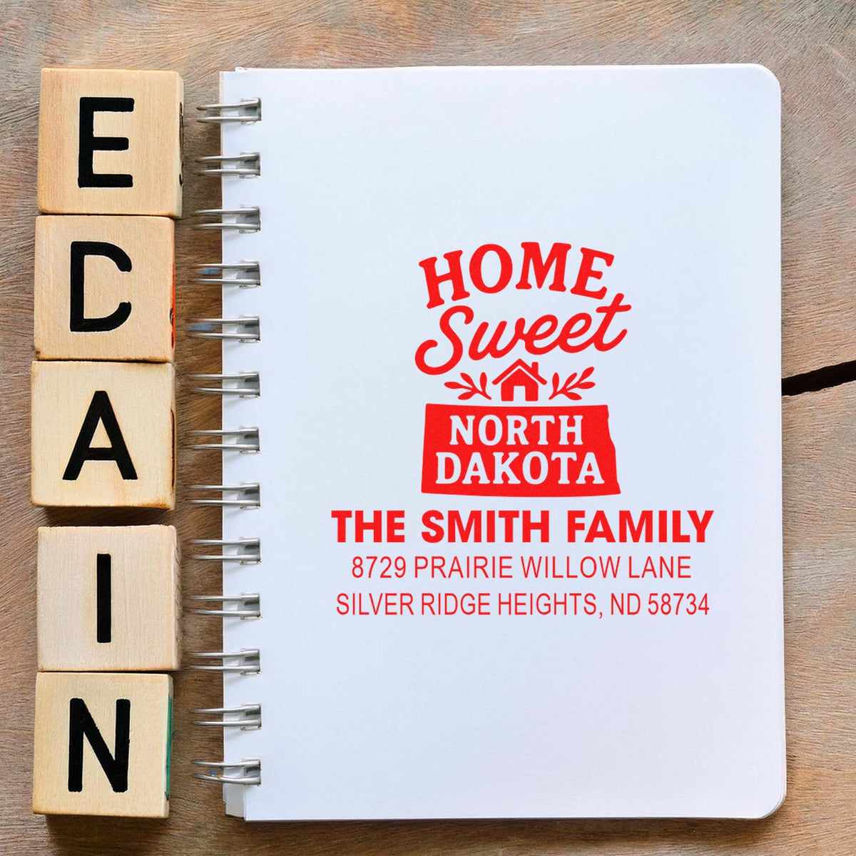 Custom rubber address stamp impression for The Smith Family, featuring Home Sweet North Dakota housewarming return address design.