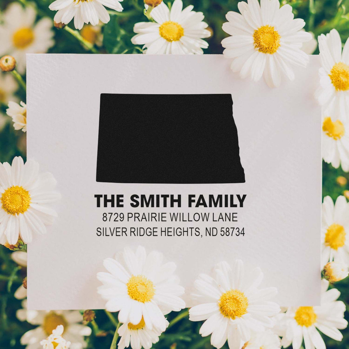 Custom personalized return address rubber stamp for The Smith Family on a floral envelope.