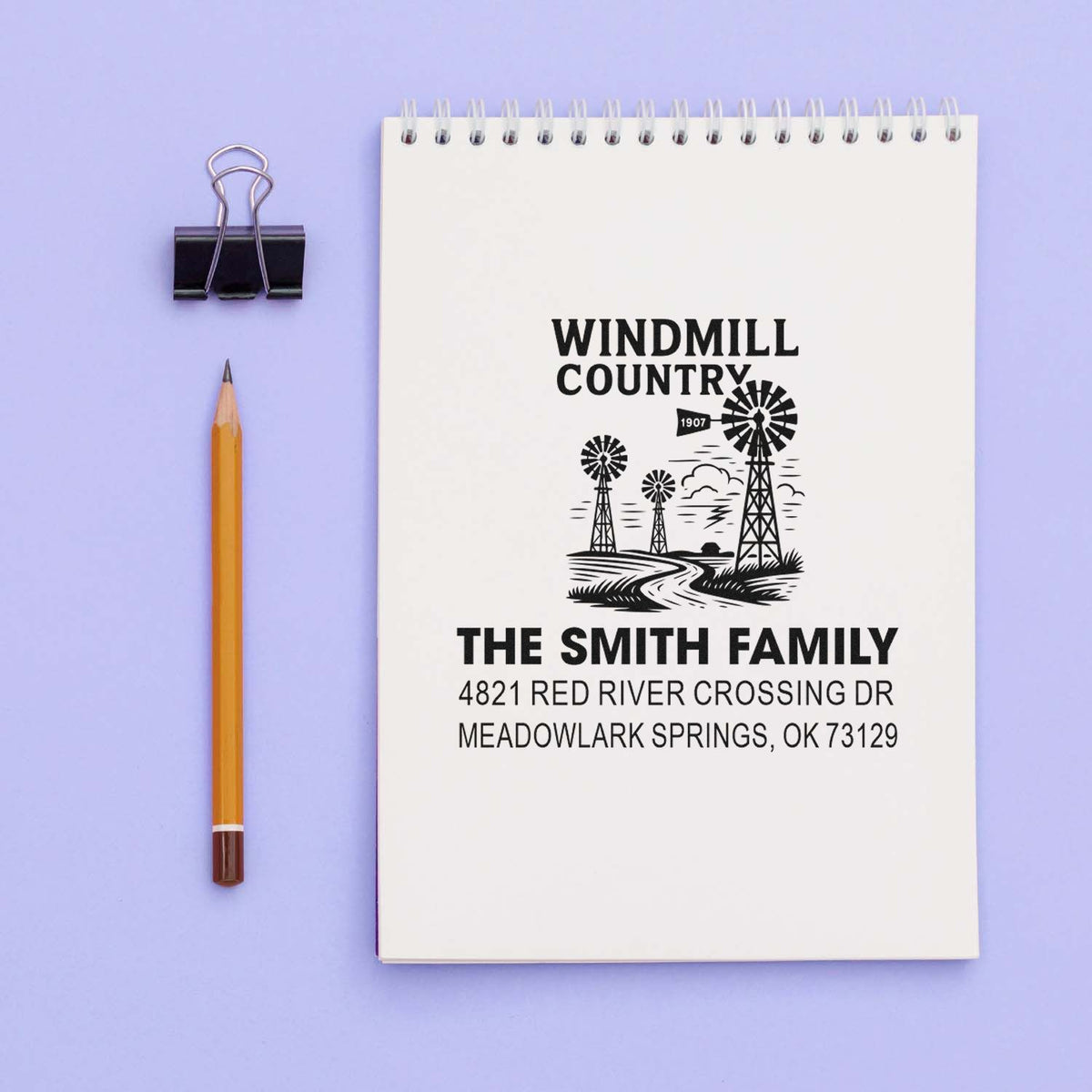 Custom address rubber stamp impression on notebook, featuring Windmill Country design for The Smith Family, Meadowlark Springs, OK.