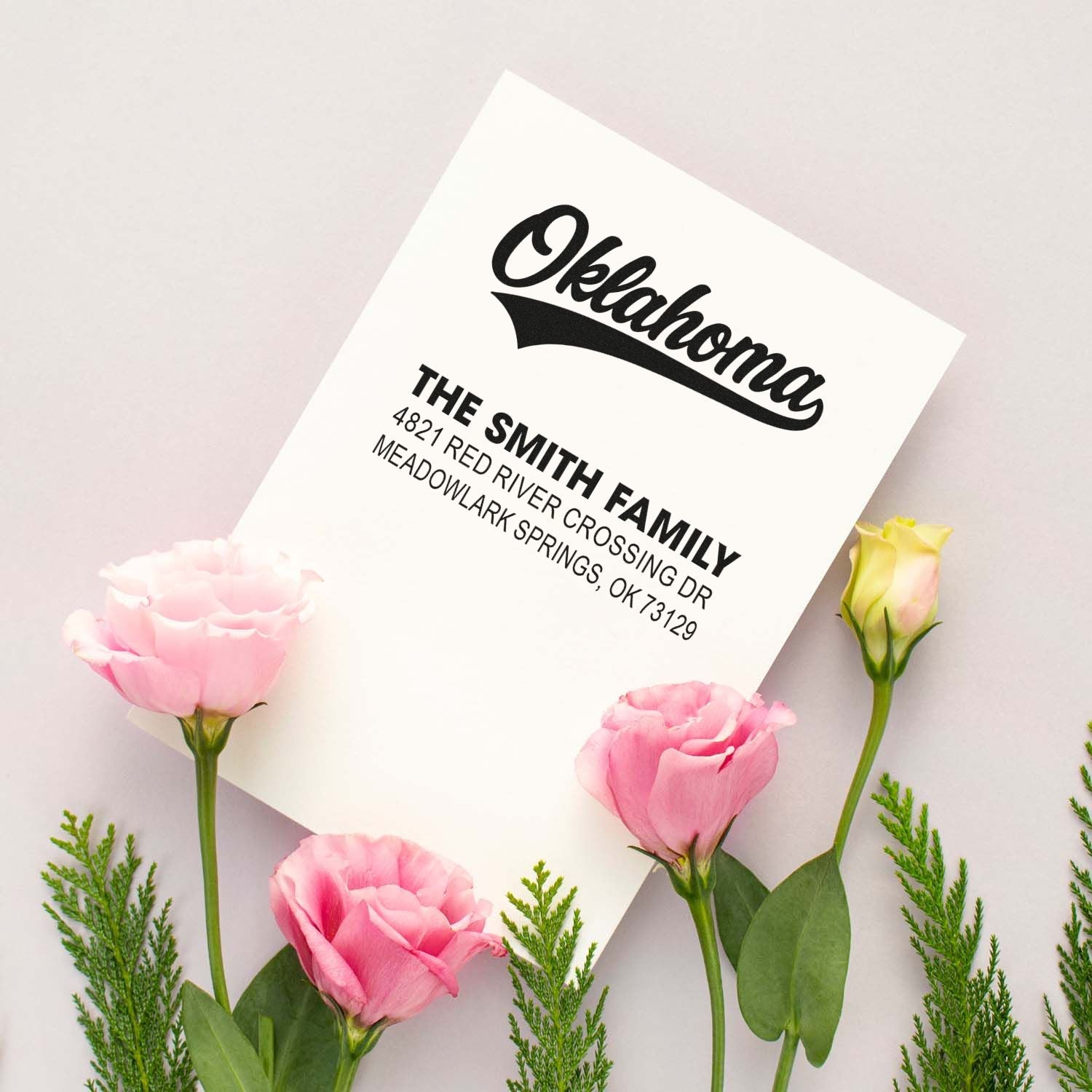 Custom address rubber stamp for The Smith Family, Oklahoma return address design with floral backdrop.