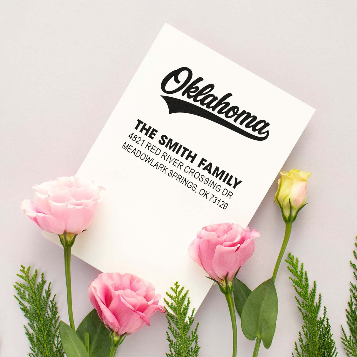 Custom return address rubber stamp for the Smith family in Oklahoma, displayed on floral stationery.
