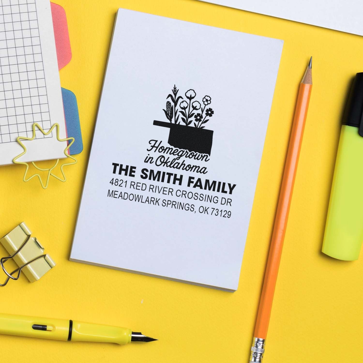 Personalized return address rubber stamp with Homegrown in Oklahoma design, family name, and address on stationery mockup.