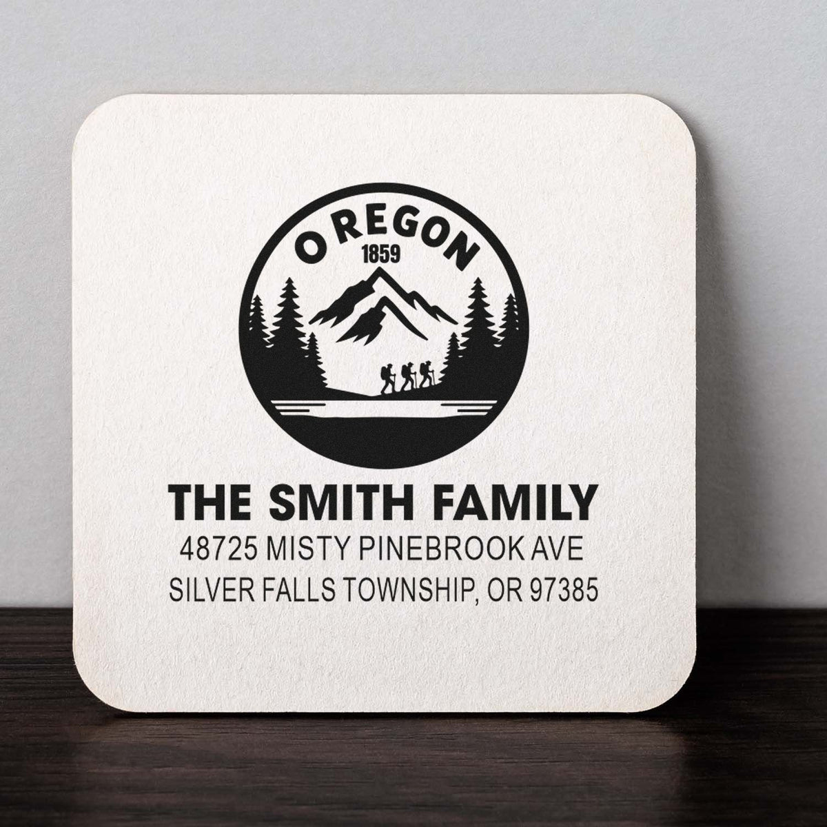 Personalized Oregon family address rubber stamp with mountain logo and custom name, street address, and ZIP code.