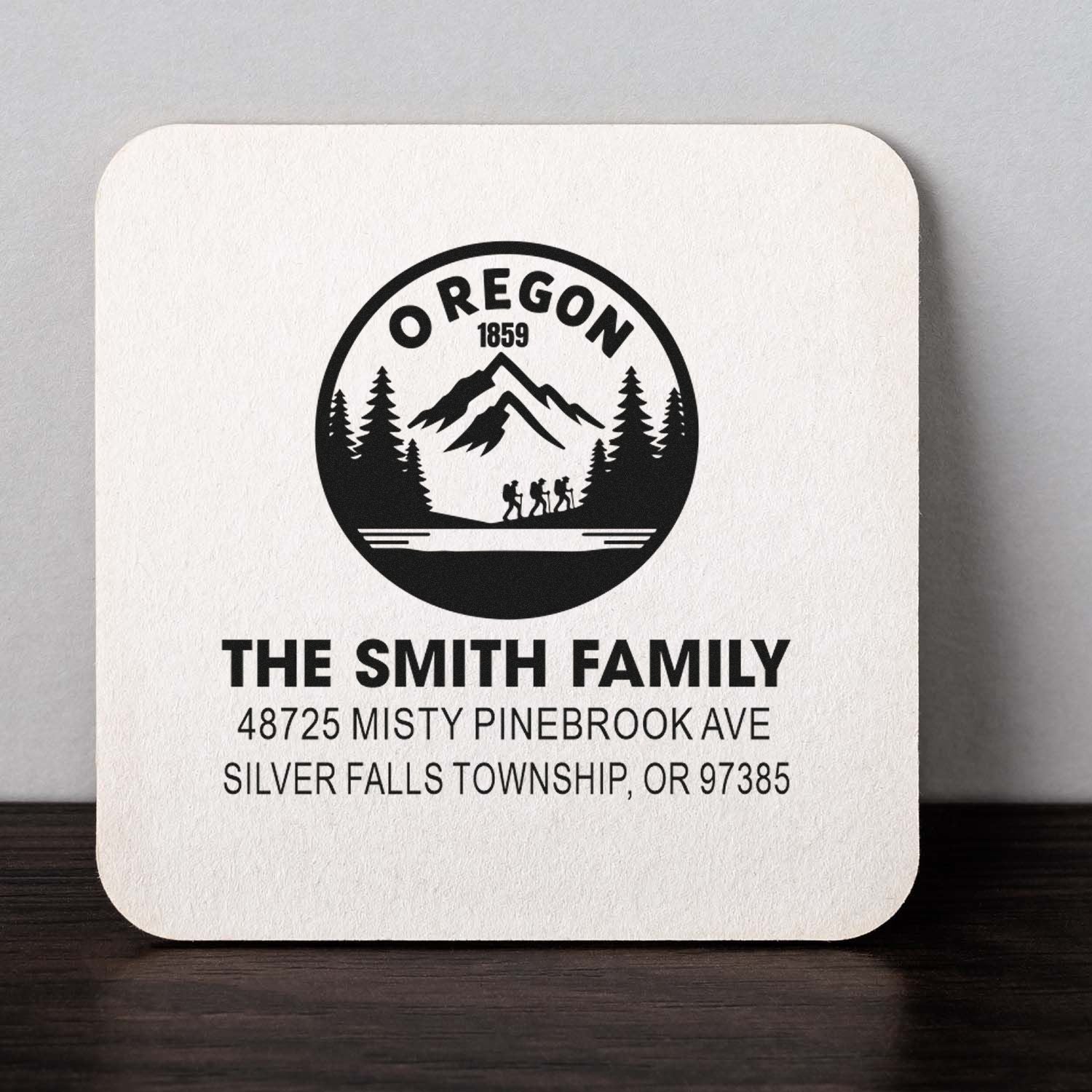 Custom Oregon family address rubber stamp with mountain and hiker logo, featuring The Smith Family and mailing address.