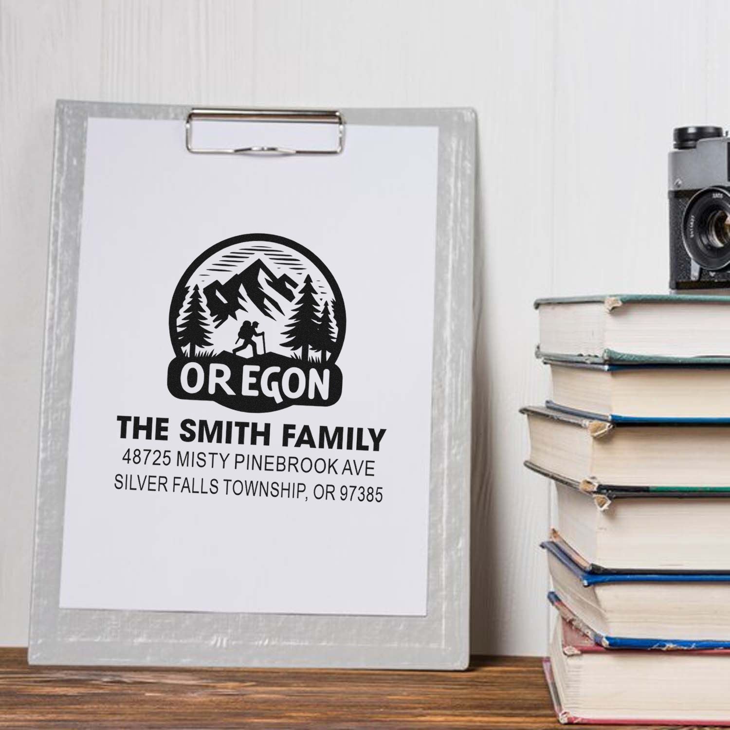 Custom Oregon family address rubber stamp with mountain hiking logo and personalized name and address.