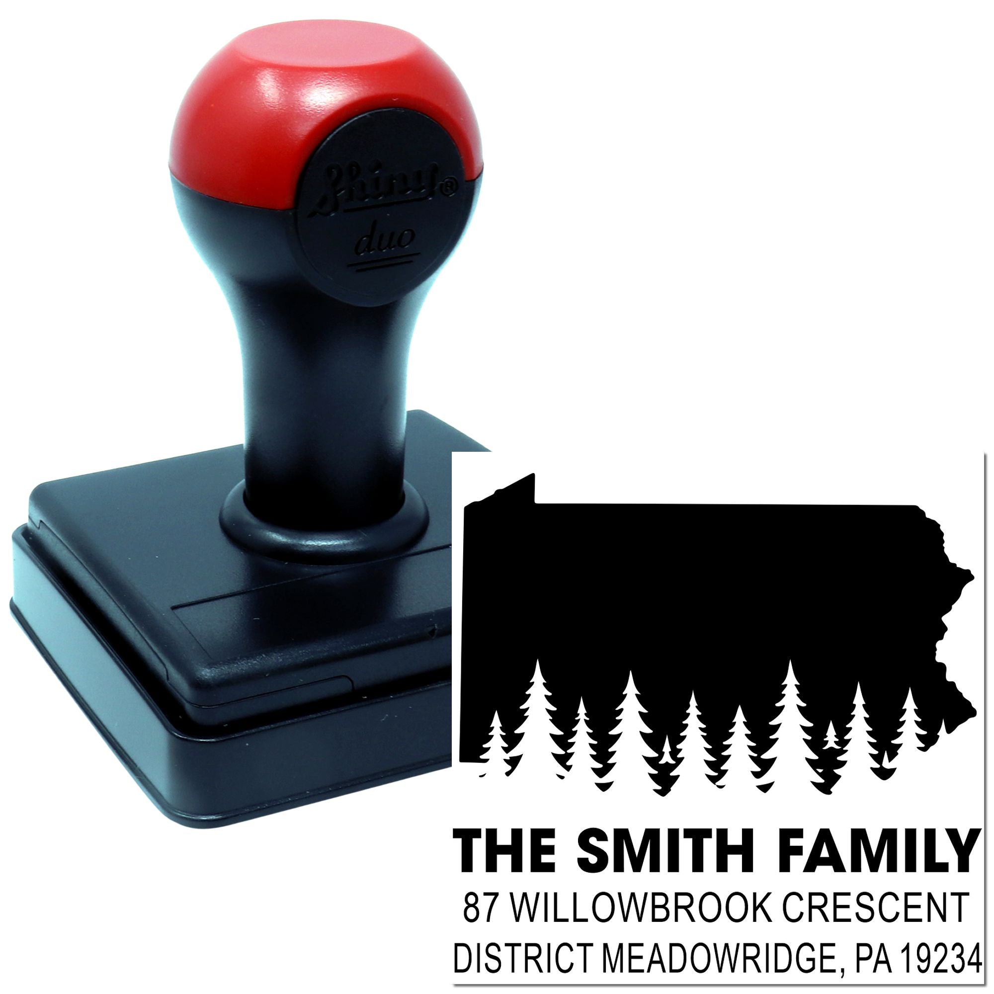 Custom self-inking return address stamp with Washington state silhouette, trees, and Smith family address design.