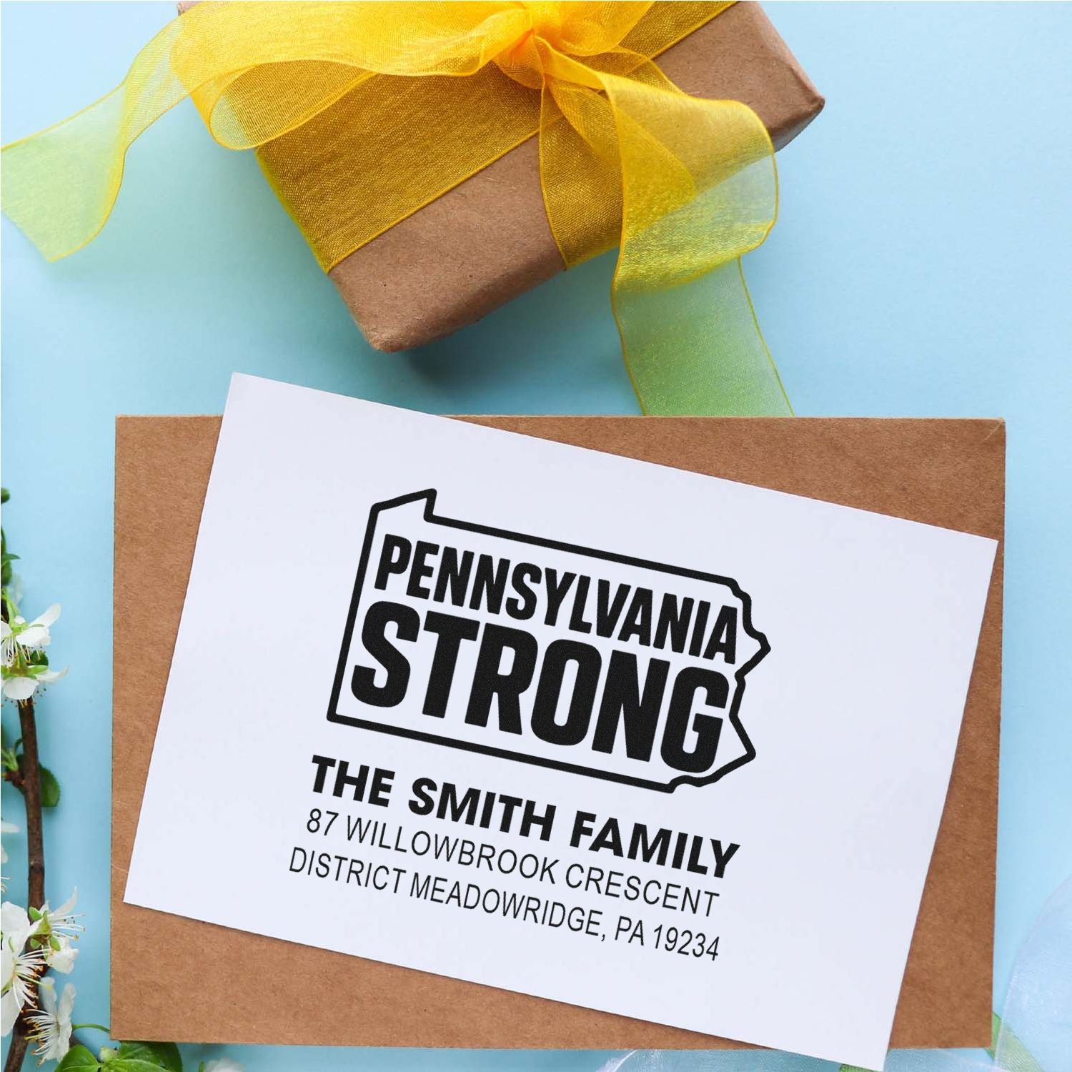 Custom Pennsylvania Strong address rubber stamp on a gift package for personalized family mail and packaging