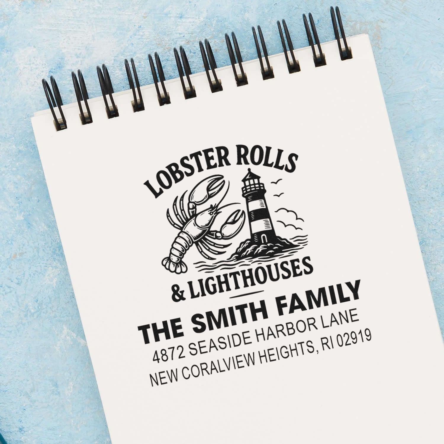 Custom rubber address stamp preview with lobster rolls and lighthouse design for The Smith Family coastal mailing address.