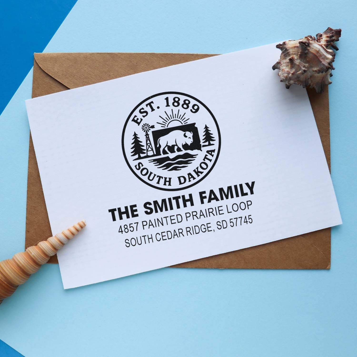 Custom address rubber stamp with South Dakota state emblem for family mail, envelopes, and invitations.
