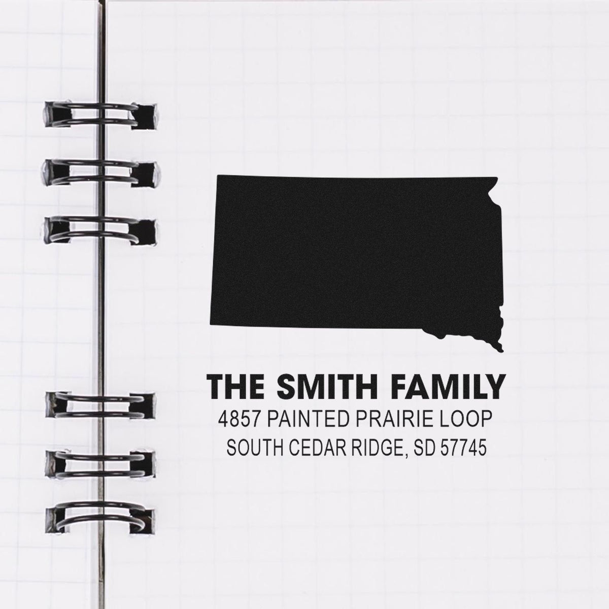 Custom rubber address stamp for The Smith Family with South Dakota state silhouette and mailing address.