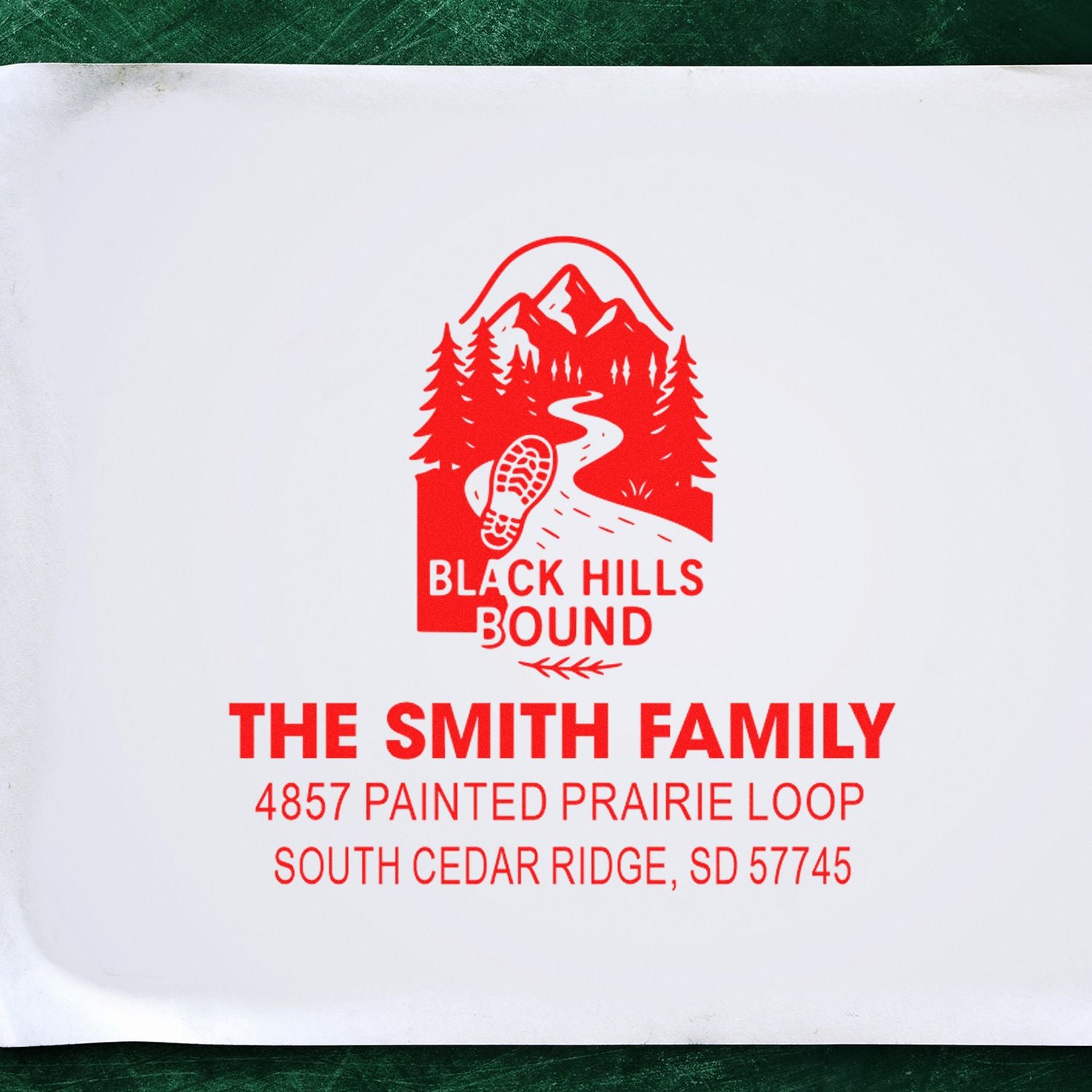 Custom rubber stamp for The Smith Family with Black Hills Bound logo and return address in South Cedar Ridge, SD.