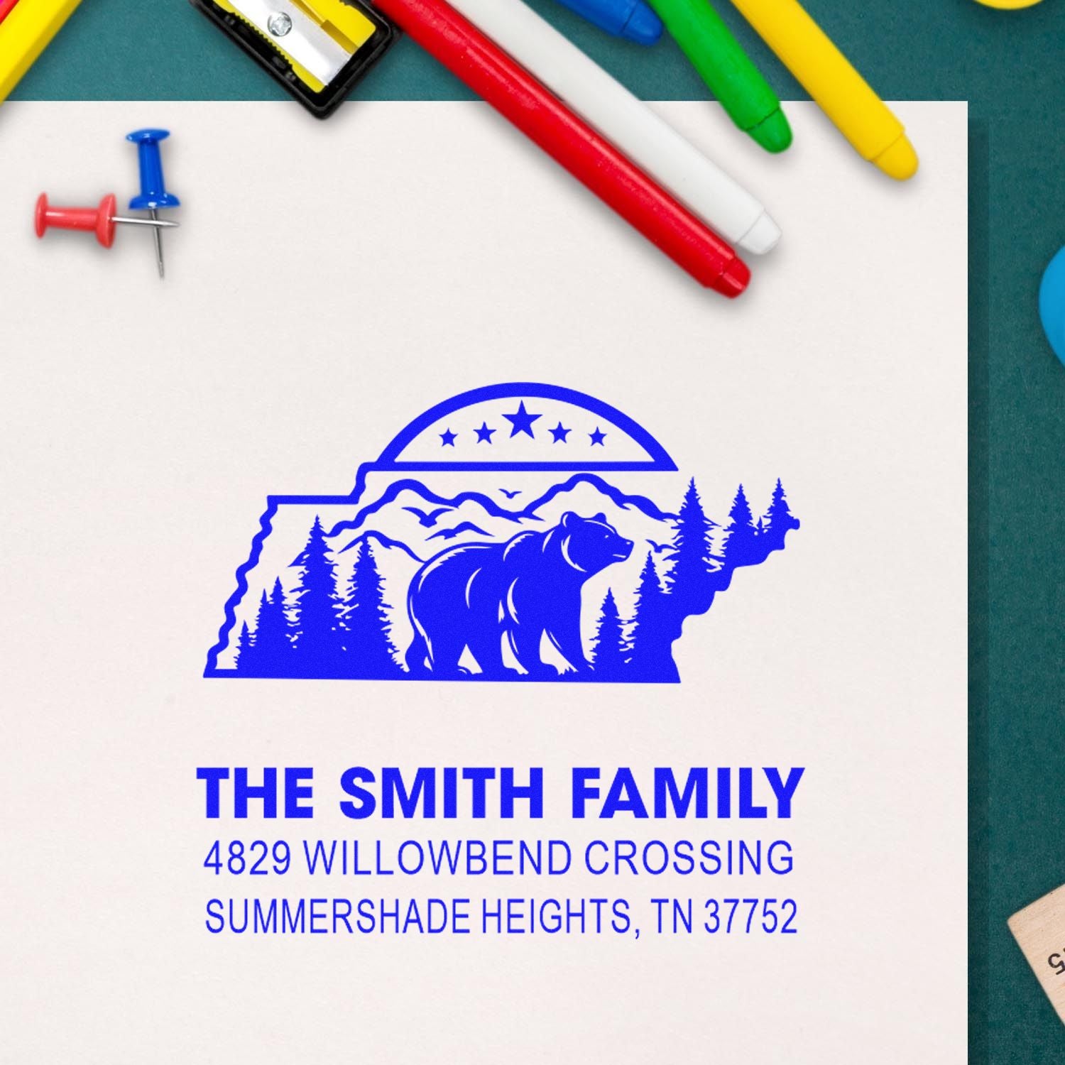 Custom rubber address stamp for The Smith Family with bear and forest design, plus Tennessee return address.