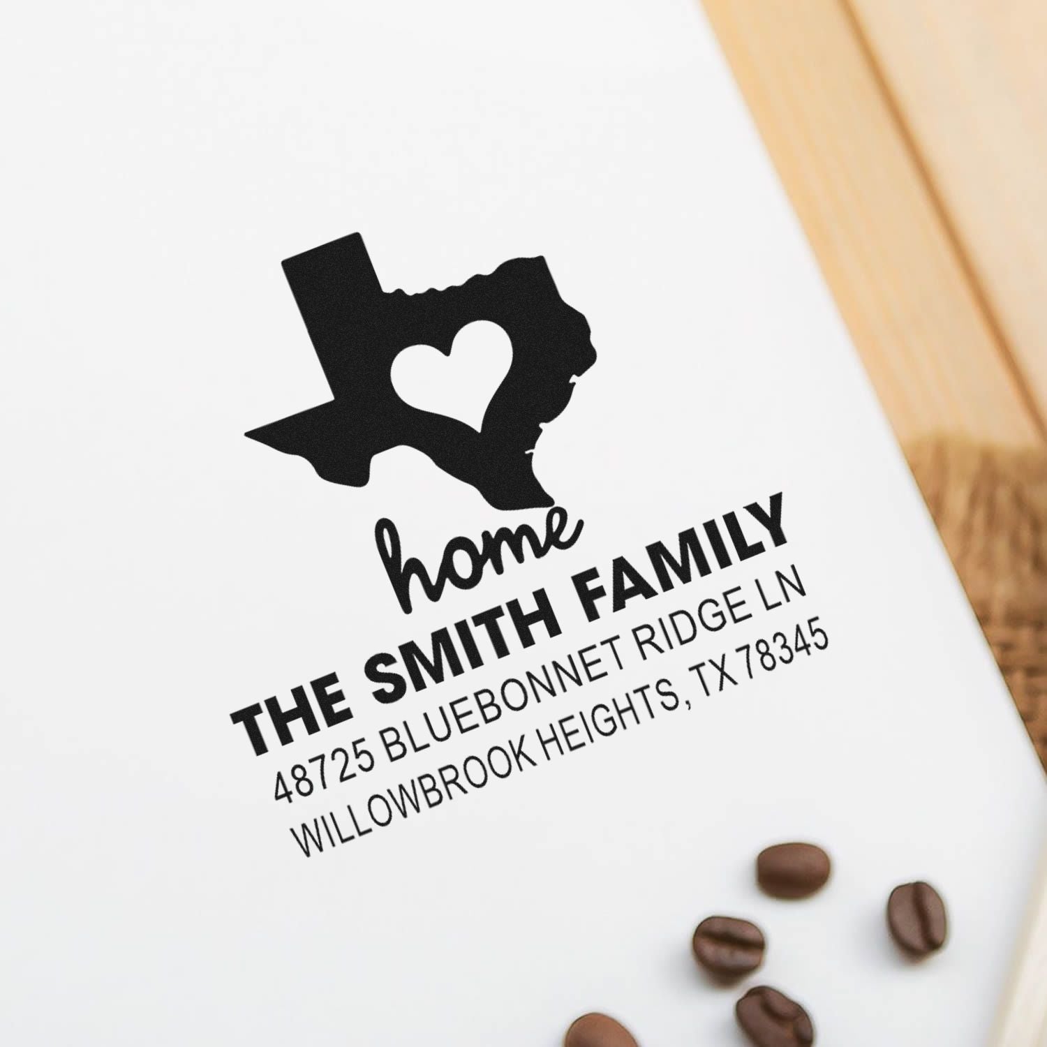 Custom Texas home address rubber stamp with heart cutout, family name, and address for personalized mailing.