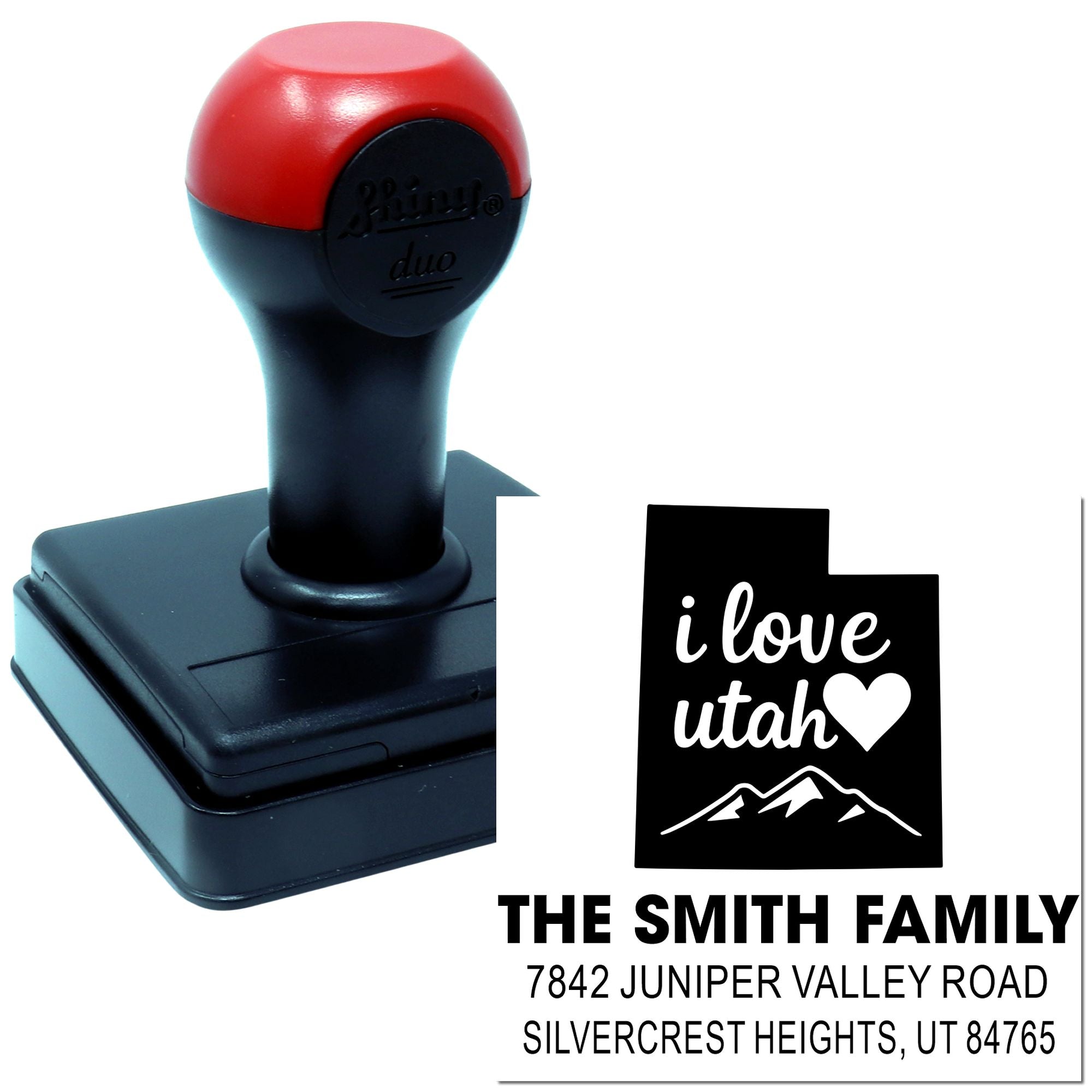 Custom self-inking rubber stamp with Utah mountain design and personalized family return address imprint.