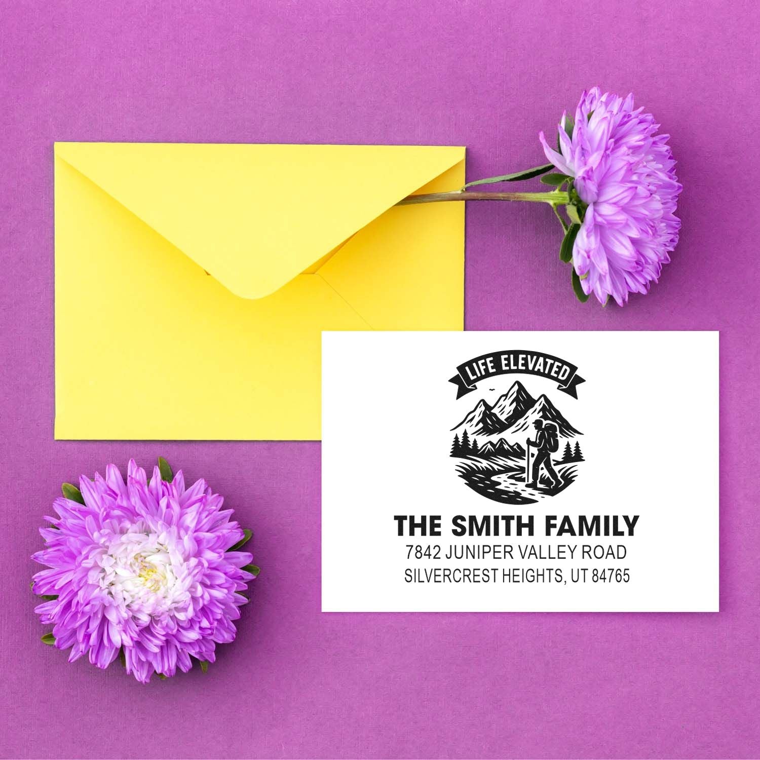 Custom return address rubber stamp for The Smith Family, featuring a mountain hiking design on a yellow envelope.